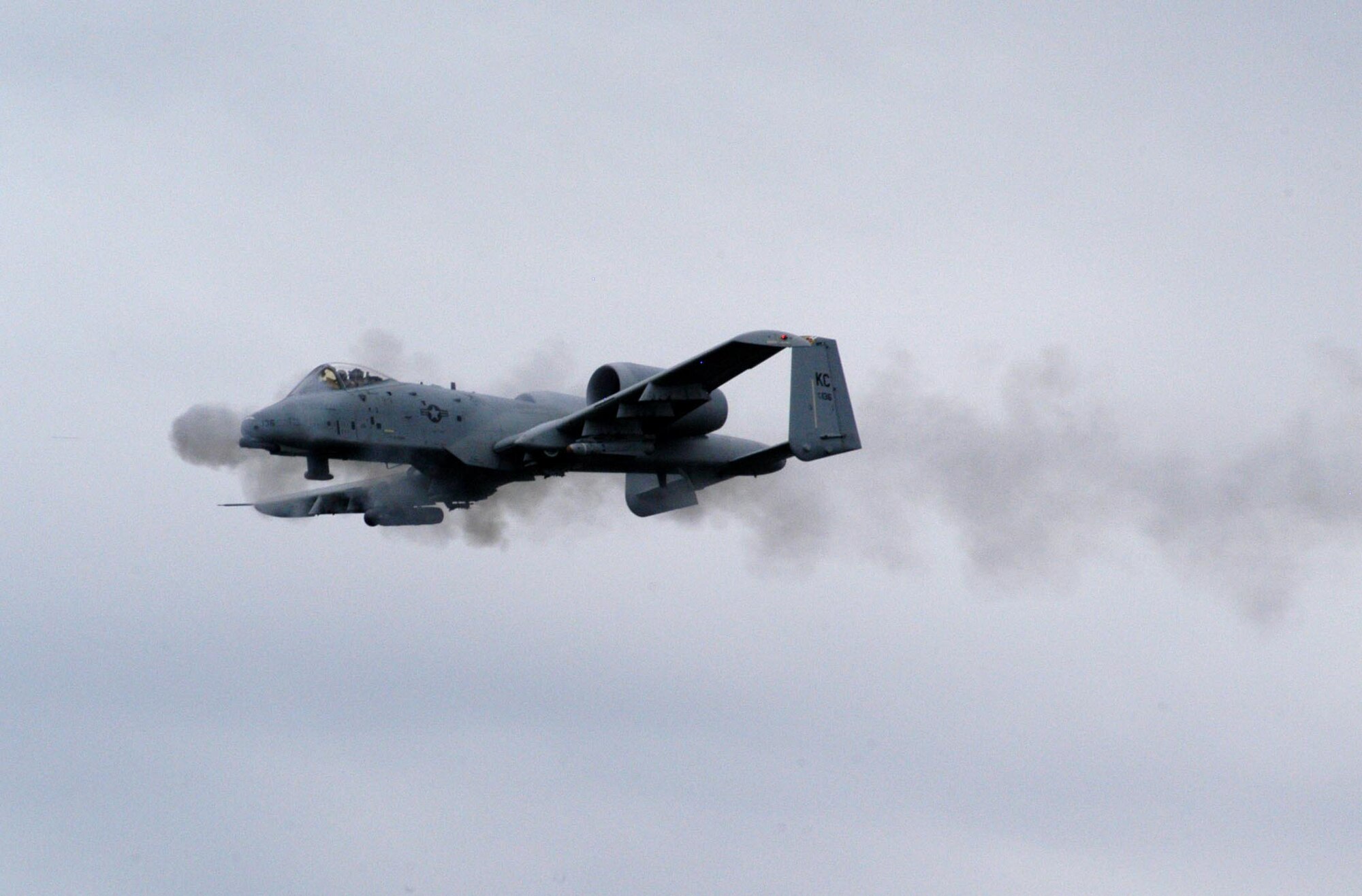 Maj. Aaron Linderman, an A-10 pilot from the 303rd Fighter Squadron, fires the 30-milimeter gun from an A-10 Thunderbolt II during a strafing run at Cannon Range near Ft. Leonard Wood, Mo., June 20, 2007.  The 303rd FS is part of the Air Force Reserve's 442nd Fighter Wing based at Whiteman Air Force Base, Mo.  The wing flies to Cannon Range virtually every day to ensure its pilots stay proficient in the close air support mission the A-10 was designed for. Cannon Range, managed by the Missouri Air National Guard's 131st Fighter Wing, plays a crucial role in the training and readiness of pilots from Reserve, Guard and active-duty units from all over the United States.  (U.S. Air Force photo/Maj. David Kurle) 