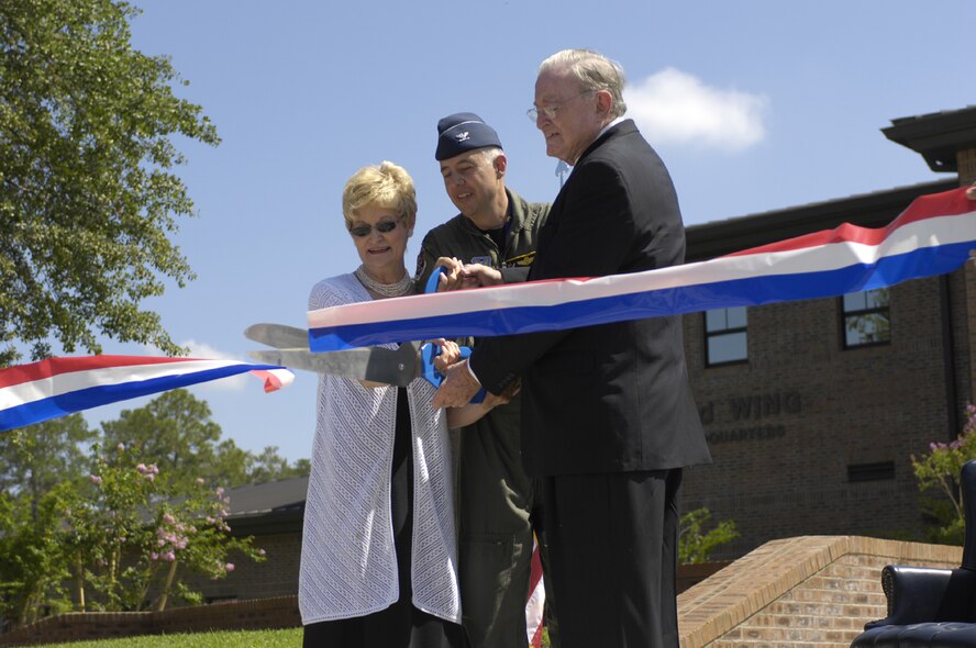 With Parker Greene and his wife Lucy by his side, Col. Kenneth Todorov, 23rd Wing commander, cuts the ribbon official dedicating Moody Air Force Base’s new $10 million consolidated customer service facility as the Parker Greene Base Support Center June 22. Through his support to the base and its Airmen, Mr. Greene has been a vital link between the military and the South Georgia community for more than 30 years. (U.S. Air Force photo by Staff Sgt. Manuel Martinez)
