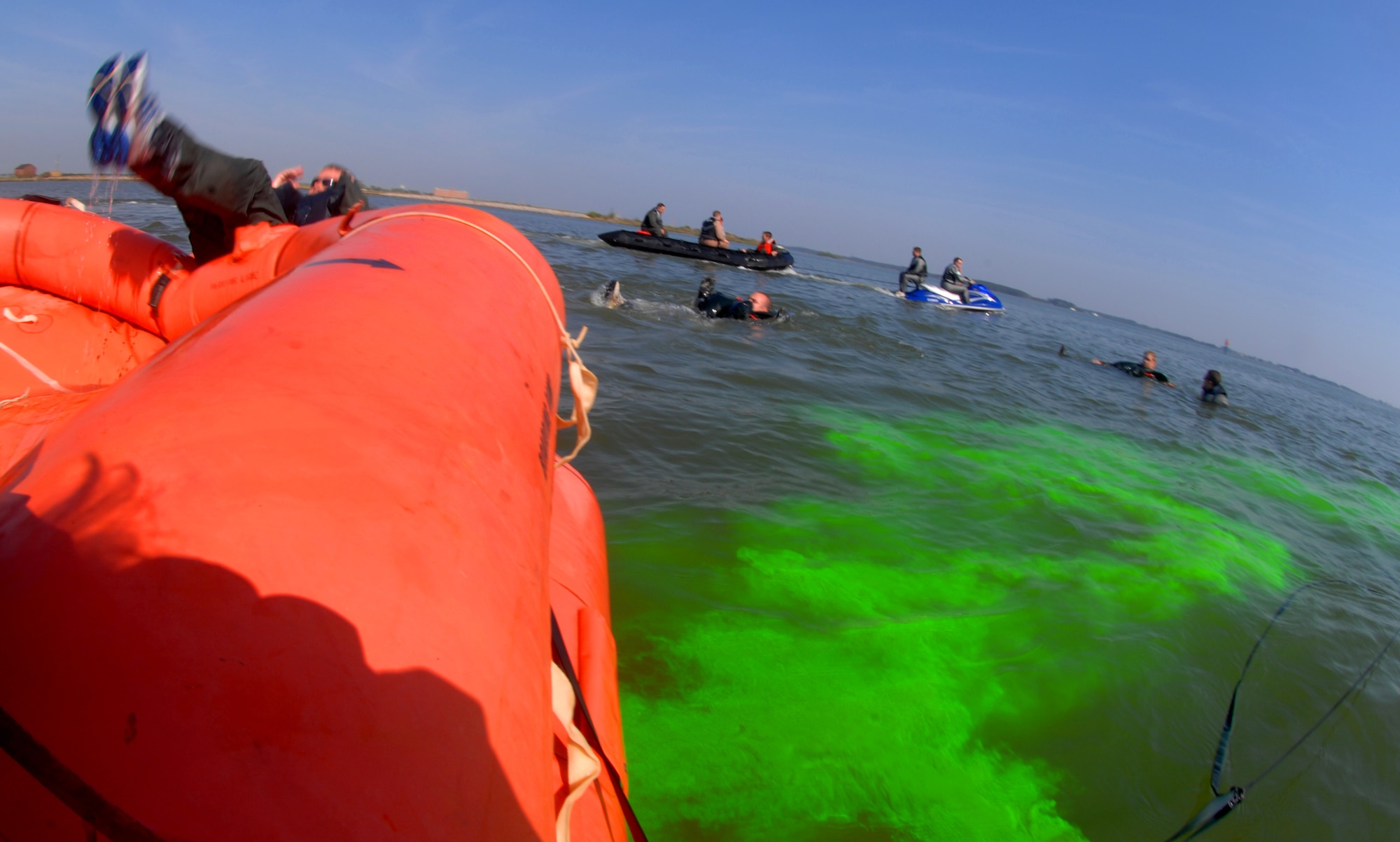 LANGLEY AIR FORCE BASE, Va. -- Pilots from the 1st Operations Support Squadron perform an emergency evacuation from a raft, also know as a 20-man egress, during survival, evasion, resistance and escape water survival training here June 20. During the summer, the 1st OSS holds SERE training sessions twice a month for cadets entering pilot training. (U.S. Air Force photo/Senior Airman Tabitha Kuykendall)
