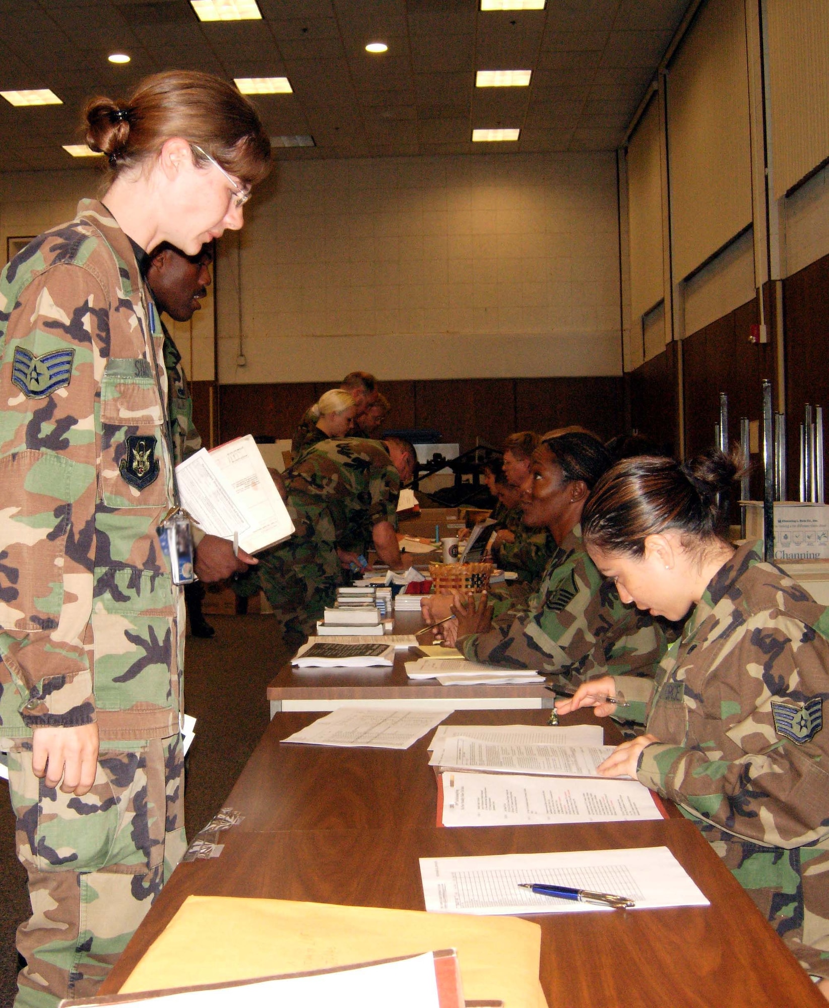 ANDREWS AIR FORCE BASE, Md. -- Staff Sgt. Sara Sims, 459th Aircraft Maintenance Squadron jet engine mechanic, watches as Staff Sgt. Marisol Salgado, 459th Logistics Readiness Flight information management journeyman, checks Sergeant Sims's training records. Members of the 459th Air Refueling Wing completed mobility line tasks prior to their deployment to Incirlik Air Base, Turkey. (U.S. Air Force photo/Lt. Col. Mike Laughton)