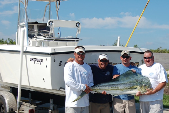 PATRICK AIR FORCE BASE - A crew of Team Patrick mission partners reeled in the largest catch in the Dolphin Class propelling them to 1st place status during the Central Florida Offshore Anglers Tournament held June 23rd off of Port Canaveral, Fla.  They won with a weight of 44.6 lbs during the contest.  Pictured left to right the Crew of the "Brassy Hooker" - Master Sgt. Tim Baxley, 920th Rescue Wing; Tech. Sgt. Brad Spalding (Captain), DDMS; Master Sgt. Steve Richmond, 920th Rescue Wing; and Mr. John "Big White" Starkey, 45th Services Squadron. 
According to Sergeant Spalding, prior to the contest, his 13-year-old fishing enthusiast daughter, Ashley, kissed the Black Bart "Tuna Candy" lure they used.  She bought the lure with her winnings from a tournament two weeks prior for taking 2nd place in the Junior Snapper division with an 8.4 lb Red Snapper.  She was visiting her grandparents in Indiana on the day of the tournament and was not happy she was absent for their winning catch, but prior to leaving said, "Put it in the spread!"