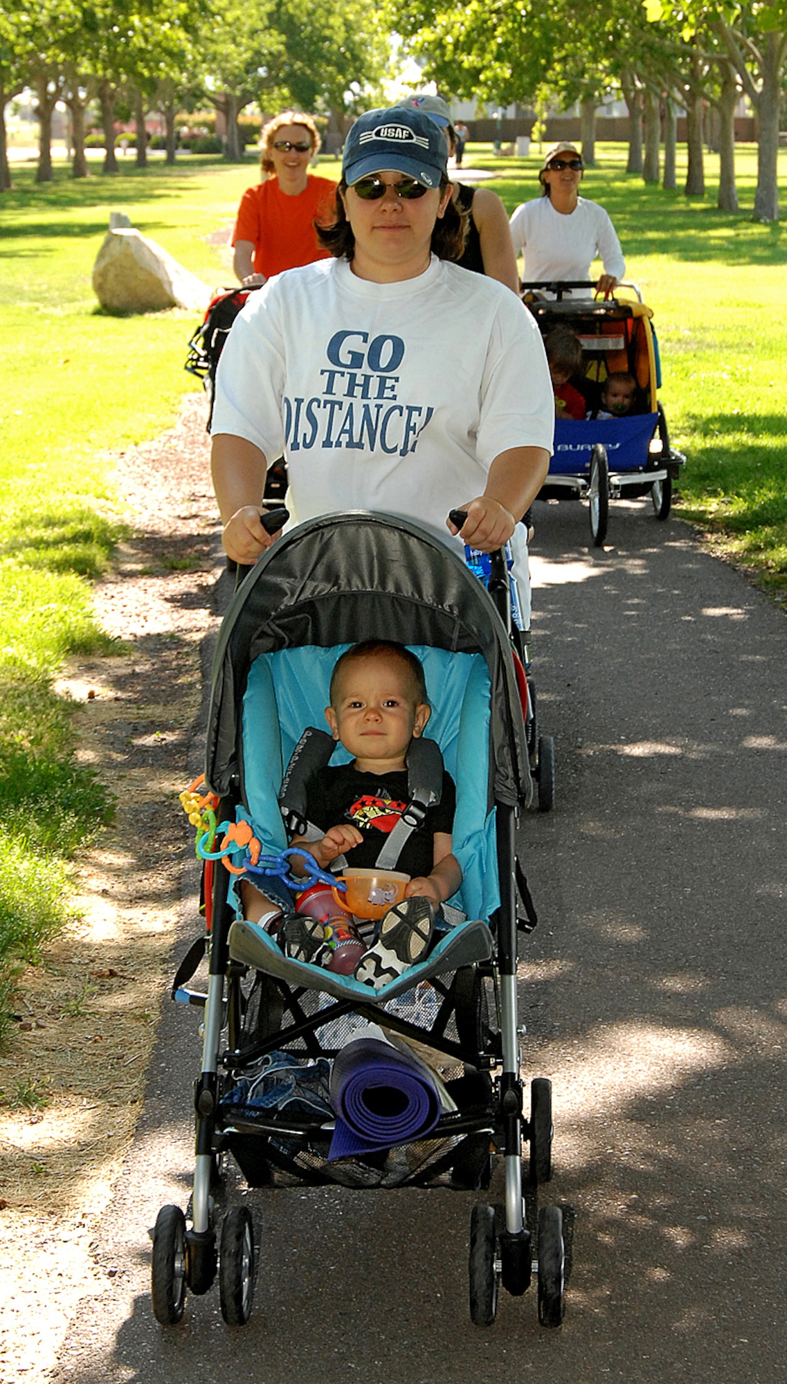 Christine Yager along with 14-month-old Noah lead the way for a lap around Hardin Field in the Baby Boot Camp class. U.S. Air Force photo by Todd Berenger

