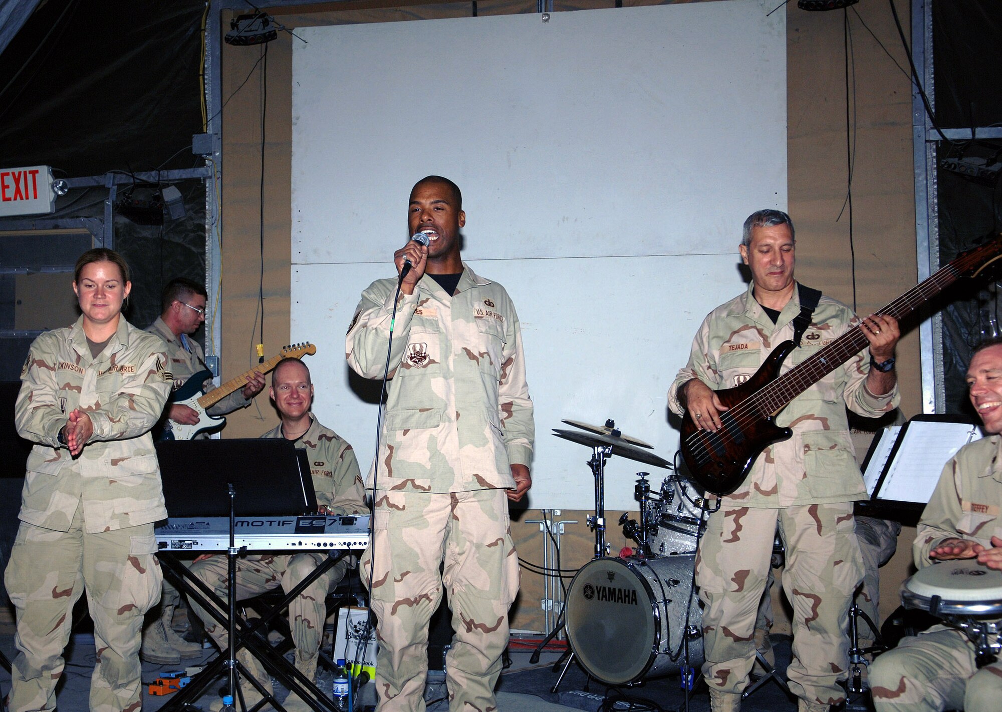 U.S. Central Command Air Forces Band members Senior Airman Helen Dickinson, Airman 1st Class Robert Barnes, Tech. Sgt. Aaron Miles, Tech. Sgt. Doug Tejada, and Maj. Chad Steffey perform in the recreation tent June 19 in Camp Cunningham at Bagram Air Base, Afghanistan. Airman Dickinson and Sergeant Miles are vocalists, Airman Barnes is a keyboardist, Sergeant Tejada is a bass player, and Major Steffey is percussionist and the CENTAF band commander. The CENTAF Band is scheduled to perform at Bagram AB July 3. (U.S. Air Force photo/Staff Sgt. Craig Seals) 
