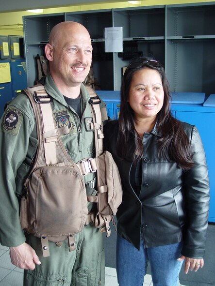 Master Sgt. Eddie Linnbaum, 21st Special Operations Squadron, and his wife Theresa wait patiently for the aircraft’s show time prior to Sergeant Linnbaum's finis flight.  (U.S. Air Force photo by Master Sgt. Dennis Brewer)