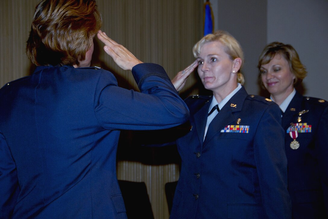 Lt. Col. Robie Hughes,  incoming 383rd Training Squadron Commander, salutes 882nd Training Group Commander Col. Nancy Dezell during the 383rd Training Squadron change-of-command ceremony. (U.S. Air Force photo/Sandy Wassenmiller)