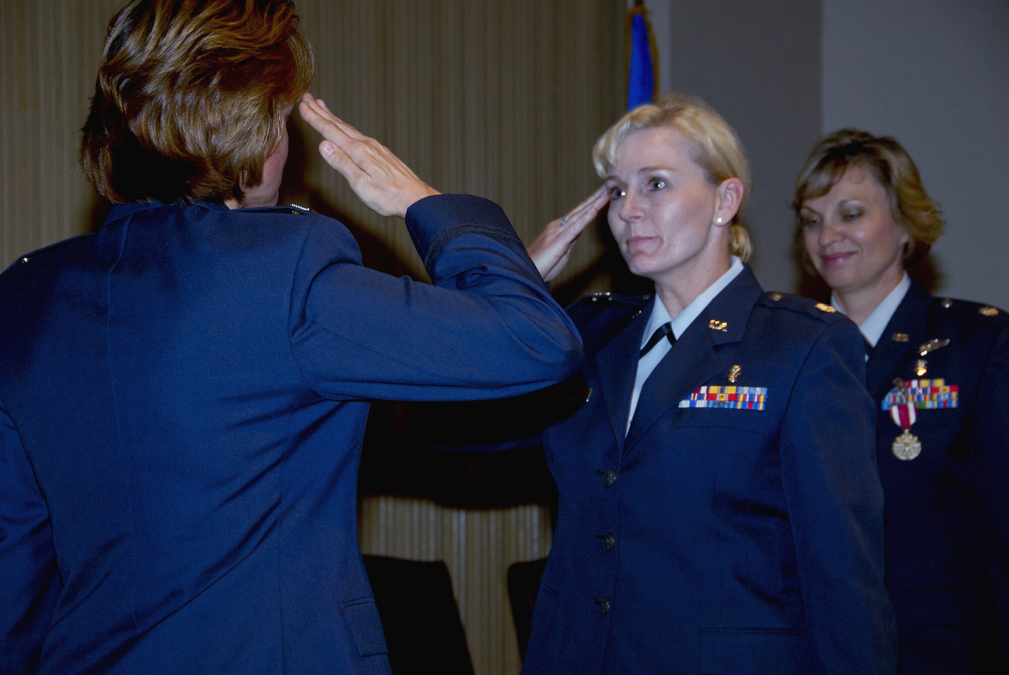 Lt. Col. Robie Hughes,  incoming 383rd Training Squadron Commander, salutes 882nd Training Group Commander Col. Nancy Dezell during the 383rd Training Squadron change-of-command ceremony. (U.S. Air Force photo/Sandy Wassenmiller)