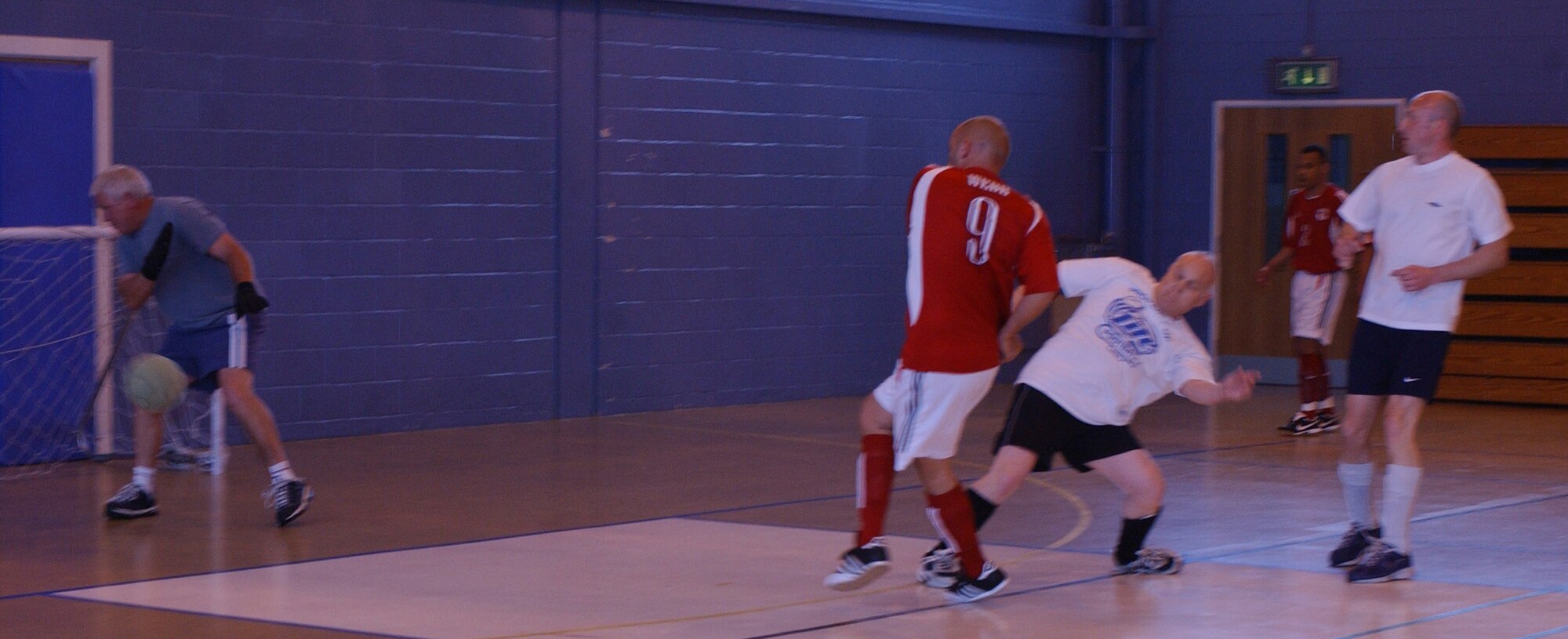 727th AMS player Pete Webb (9), equalizes against 100th CES to level the score at 1-1. (Air Force photo Airman Brad Smith)