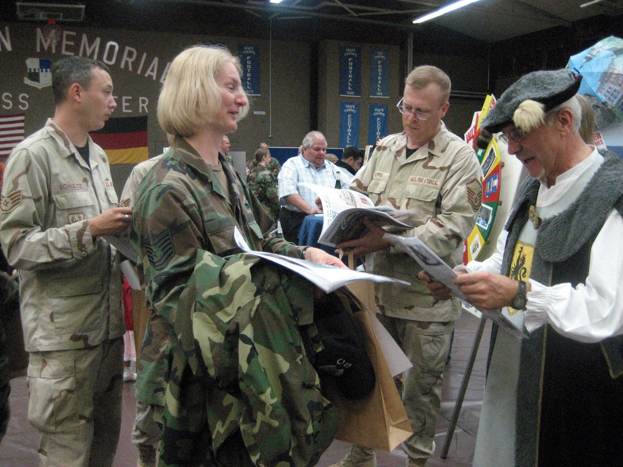 SPANGDAHLEM AIR BASE, GERMANY -- Tech. Sgt. Audrey Ripper, 52nd Communications Squadron, learns about tours and dinner activities at Cochem Castle in Cochem, Germany, at the Explore the Eifel Information Fair at Spangdahlem June 22, 2007. (US Air Force photo/Staff Sgt. Andrea Knudson)