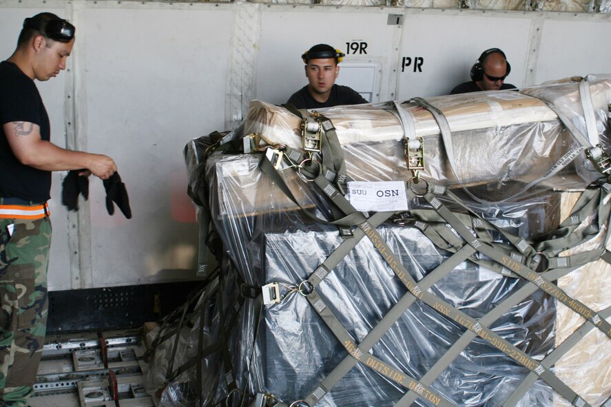 OSAN AIR BASE, Republic of Korea -- (from left to right) Staff Sgt Christopher Cranston, Airman First Class Jesus Rivera, and Staff Sgt Andrew Sandekien, 731st Air Mobility Squadron, teamed up with 51st Fighter Wing and 25th Transportation Battalion to deploy a cargo operations team of 41 personnel to Gimhae during Osan’s runway repair.  The team serviced 11 aircraft and processed 354 pallets, totaling 583 short tons of cargo.