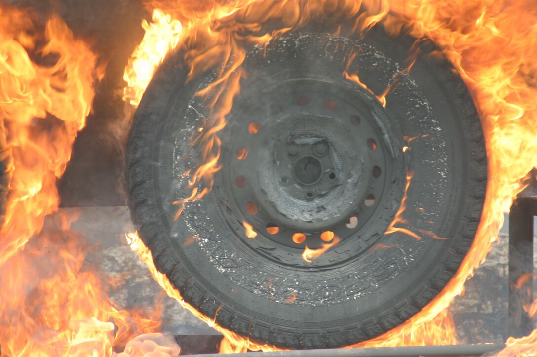 MARINE CORPS BASE CAMP LEJEUNE, N.C. (June 26, 2007)- Flames on a humvee?s tires intensify during a demonstration sponsored by the II Marine Expeditionary Force innovation and technology officer here, June 26. This was a test to show Marine leaders with 2nd Marine Division and II MEF that Arctic Fire Freeze, a fire suppressant used in the Automatic Vehicle Fire Escape and Survival System, can extinguish even the toughest flames.