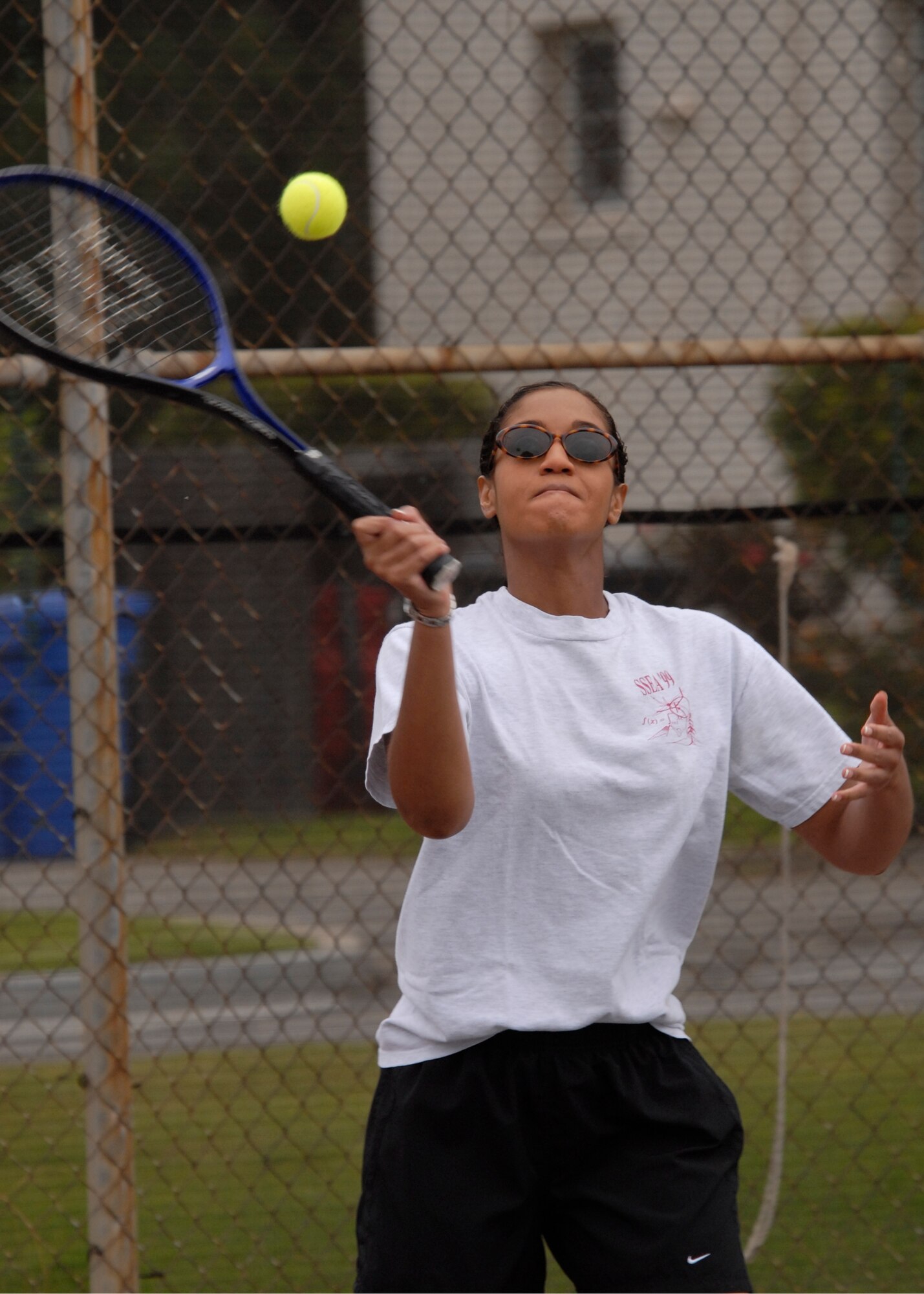 2nd Lt. Thea Norment returns a volley during the tennis competition at the 2007 SMC Sports Day, June 15.  The Space Superiority Systems Wing took the day’s overall title. (Photo by Joe Juarez)