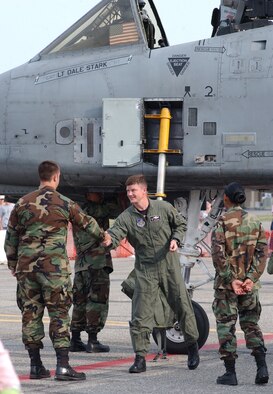 EIELSON AIR FORCE BASE, Alaska-- Lt. Col. Quentin Rideout, 355th Fighter Squadron commander, shakes hands with several crew chiefs after his A-10 flyover for a flag-folding ceremony June 23. The ceremony marked the de-activation of the 355th FS and the 18th FS. (U.S. Air Force photo by Senior Airman Justin Weaver)
