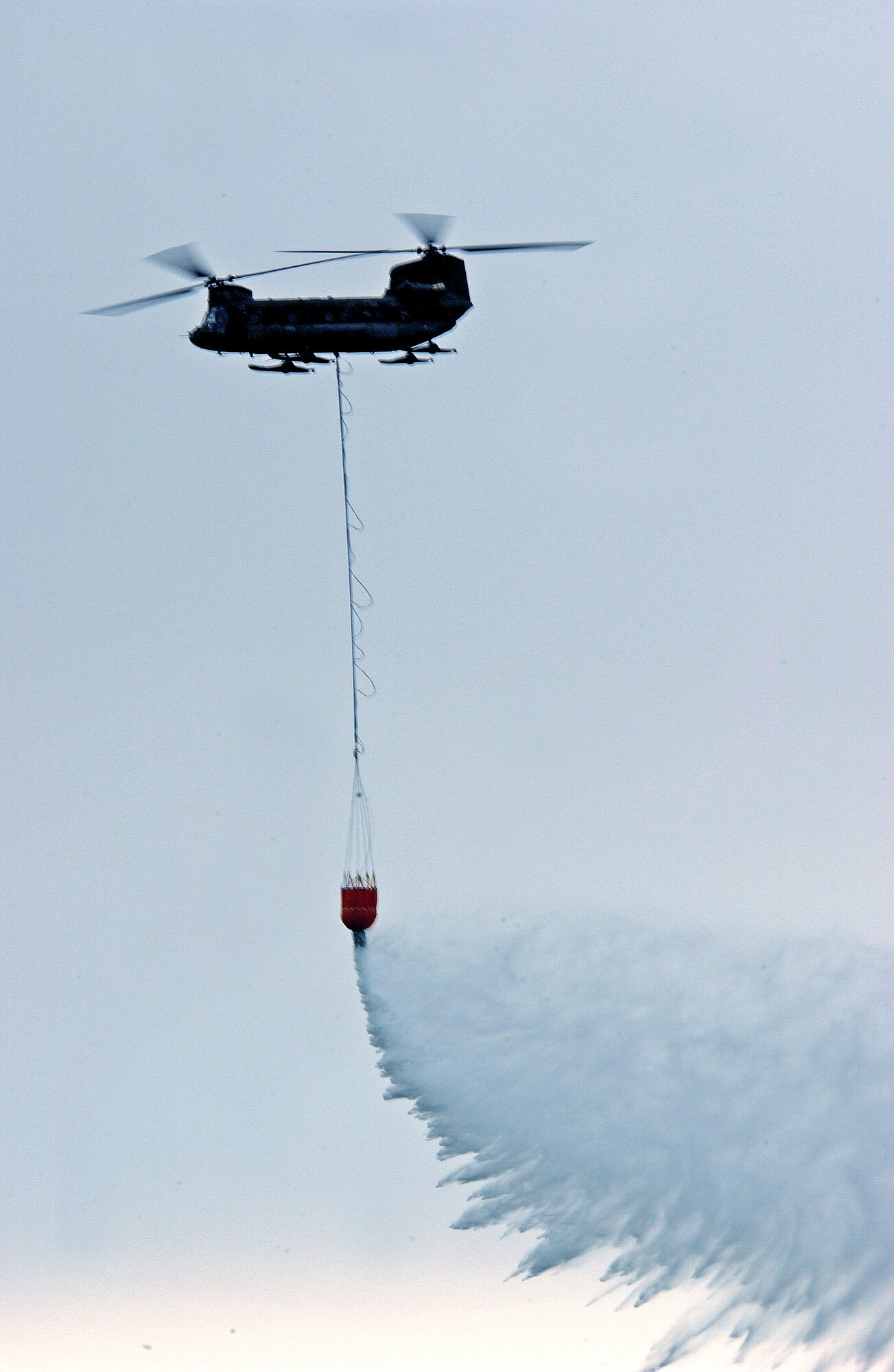 EIELSON AIR FORCE BASE, Alaska--A CH-47 Chinook makes a water drop during the 2007 Soaring into Solstice Open House June 23 here. More than 25,000 people attended the all-day event featuring aerial and ground demonstrations including flybys, simulated airfield attacks, and aerobatic maneuvers as well as concessions, live music and many aircraft displays. (U.S. Air Force photo by Senior Airman Justin Weaver)
