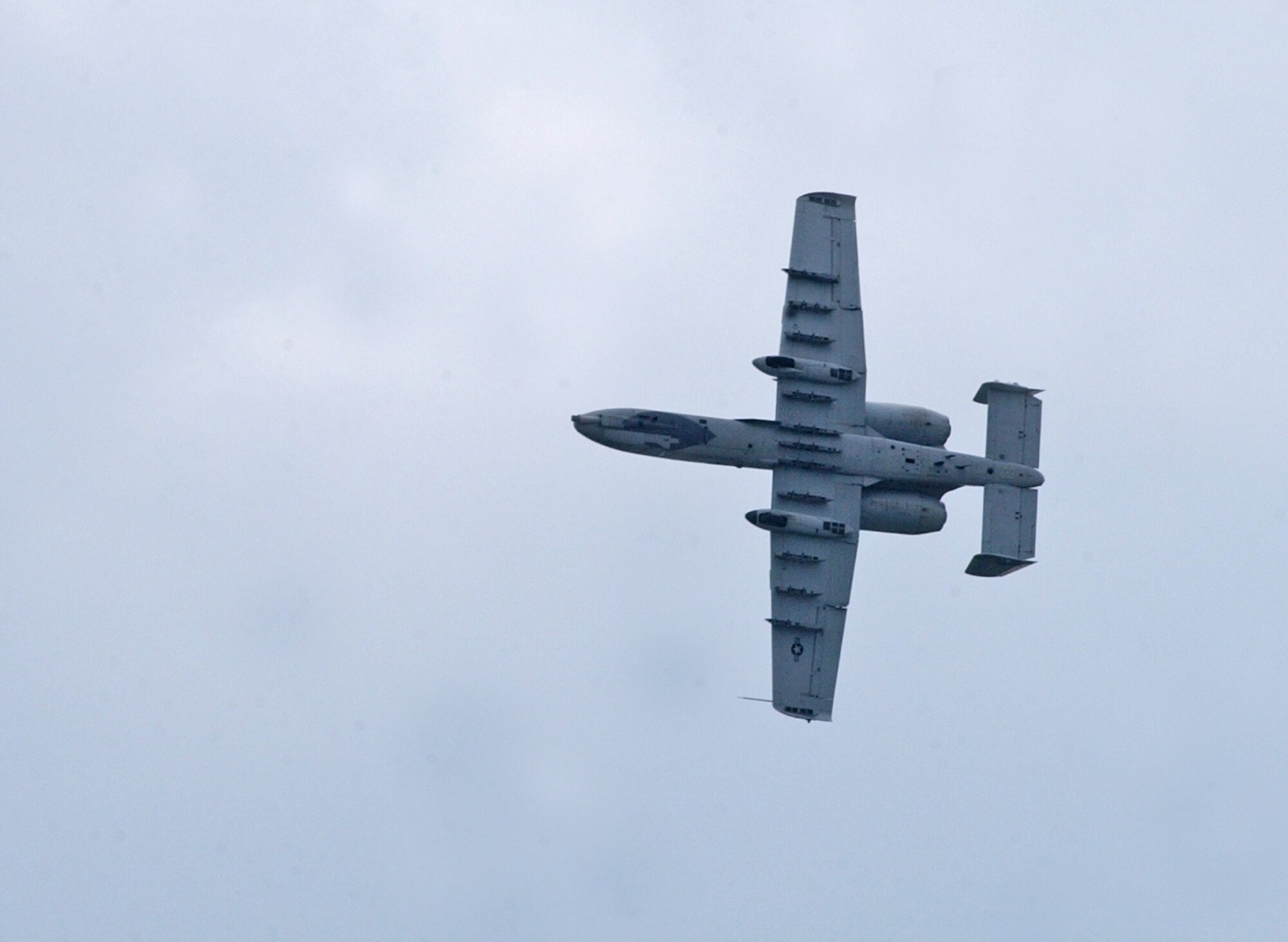 EIELSON AIR FORCE BASE, Alaska--An A-10 performs various aerobatic maneuvers during the 2007 Soaring into Solstice Open House June 23 here. More than 25,000 people attended the all-day event featuring aerial and ground demonstrations including flybys, simulated airfield attacks, and aerobatic maneuvers as well as concessions, live music and many aircraft displays. (U.S. Air Force photo by Senior Airman Justin Weaver)