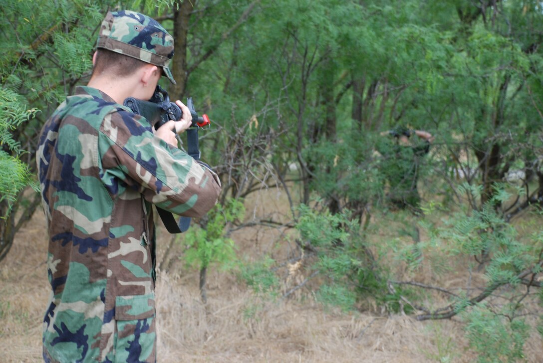 Cadet 3rd Class Evan Roth, U.S. Air Force Academy, orders a member of the opposing force down to his knees during combat skills training June 14. Cadet Roth is part of a group of academy cadets visiting Sheppard for Operation Air Force. (U.S. Air Force photo/Airman 1st Class Jacob Corbin