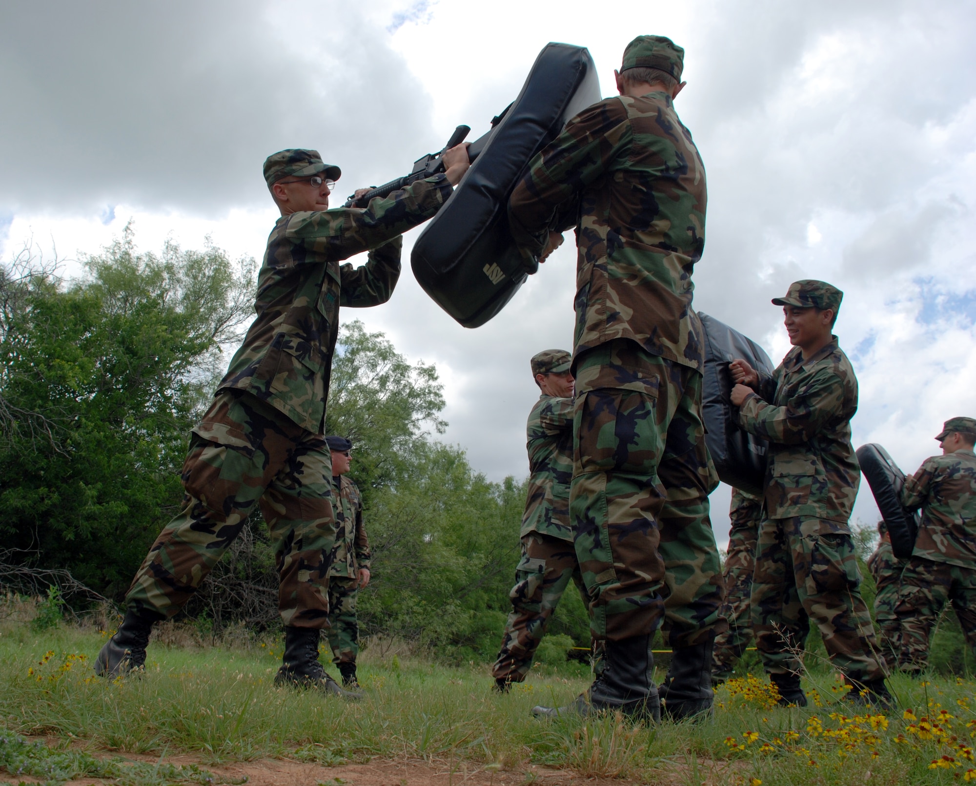 Cadet 3rd Class Chris Lovas, U.S. Air Force Academy, strikes a mat held by fellow academy member CTC Scott Hatter during combat skills training June 8. The cadets visited Sheppard as part of Operation Air Force. (U.S. Air Force photo/Airman 1st Class Jacob Corbin)