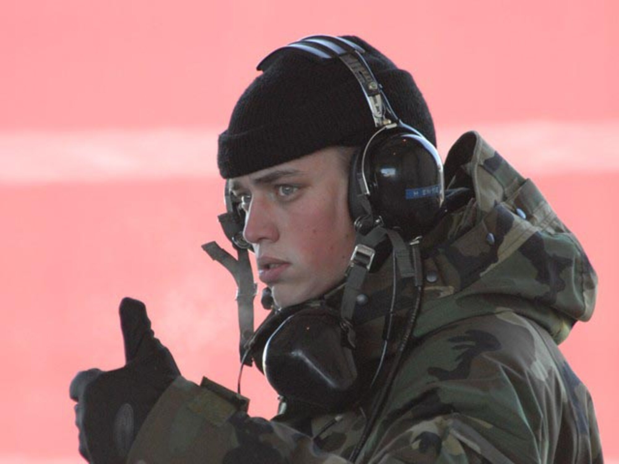 Senior Airman Bryan M. Hensel, 119th Maintenance Squadron crew chief, gives a thumbs-up during pre-flight checks as he assists in the launch of his father's F-16 aircraft.