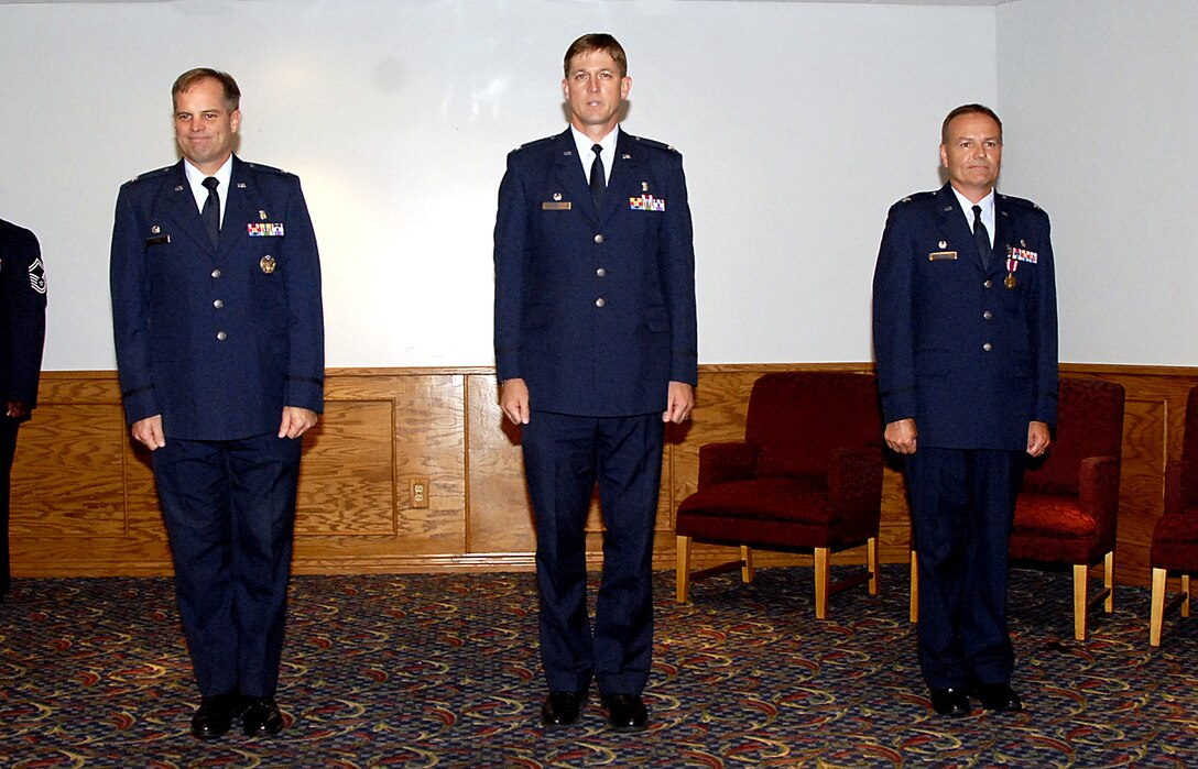 Col. James King, 82nd Medical Group commander, Col. Jeffrey Thompson, incoming 82nd Dental Squadron commander, and Col. Michael Klepczyk, outgoing 82nd DS commander, stand at attention June 25 at the 82nd DS change-of-command ceremony. (U.S. Air Force photo/Harry Tonemah)