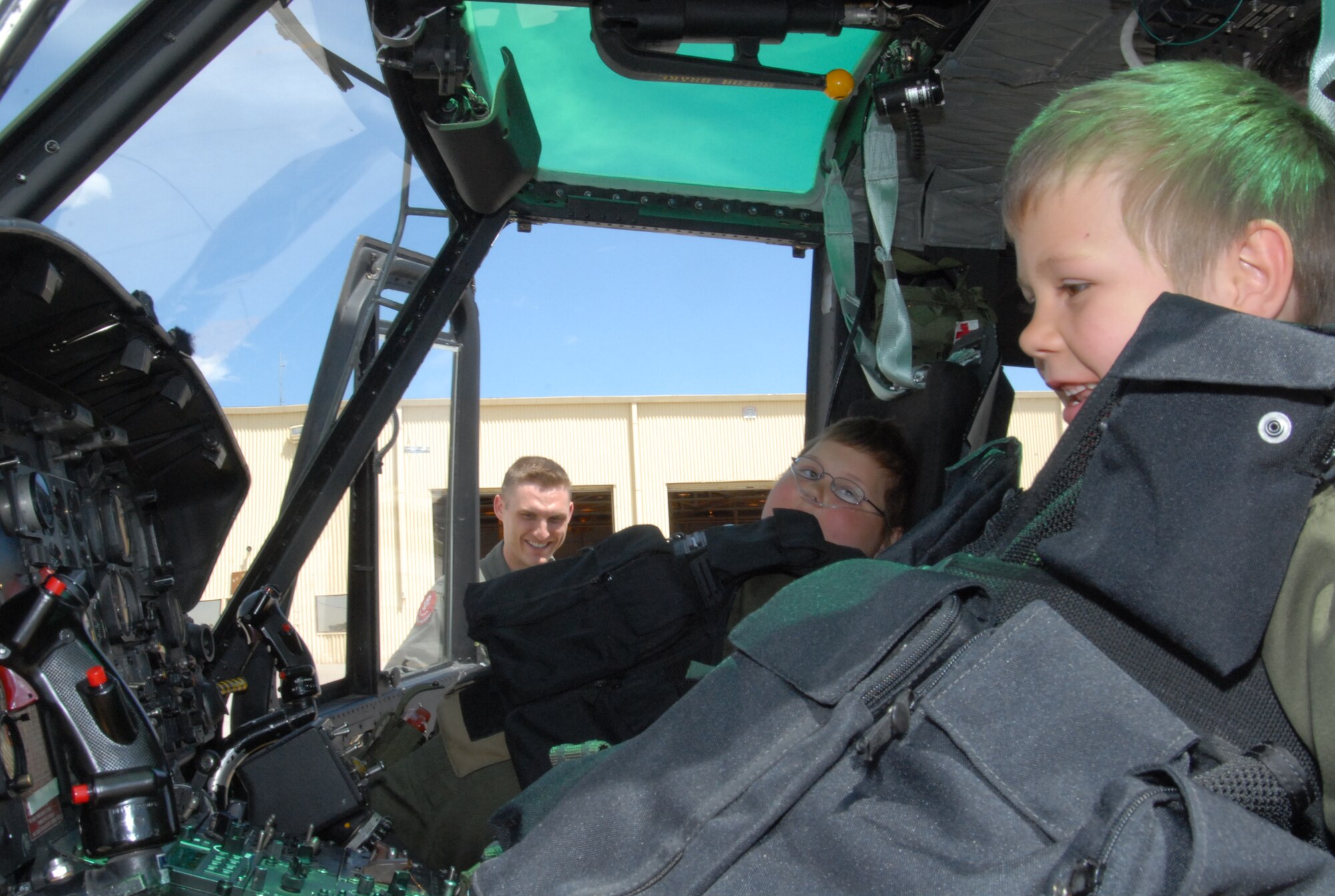 Avery Ruskey-Moffett, Ariana’s brother, and Ariana check out a UH-1N Iroquois helicopter from the 37th Helicopter Squadron. The children and their parents also experienced the military working dogs, Chadwell dining facility and uniform-01, learning about the missile mission and Warren.