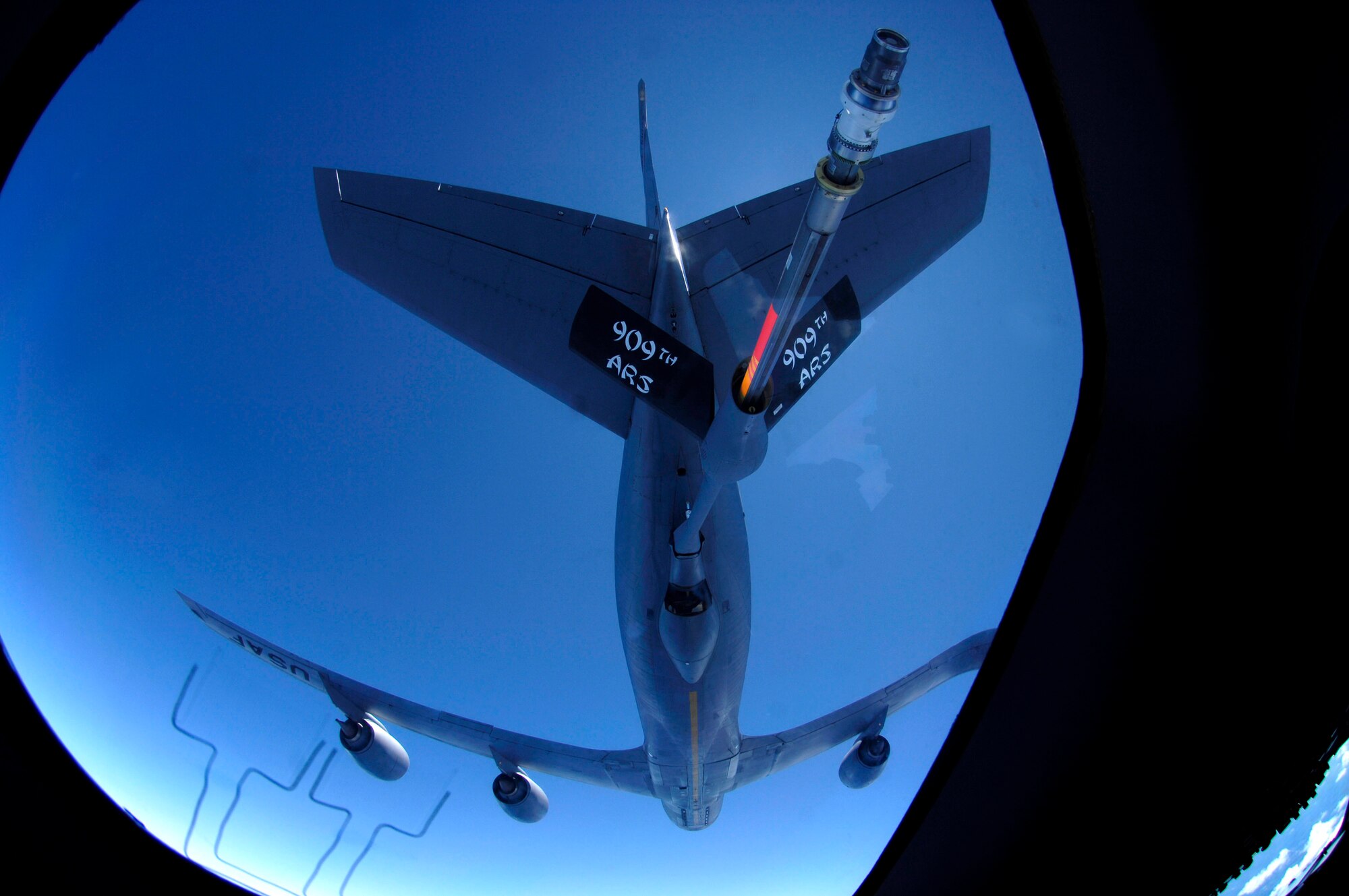 A C-17 Globemaster III approaches the boom of a KC-135 Stratotanker June 22 during aerial refueling practice over the Pacific Ocean. The C-17 from the 535th Airlift Squadron, Hickam Air Force Base, Hawaii, and the KC-135 from the 909th Air Refueling Squadron at Kadena Air Base, Japan, are practicing for the upcoming 2007 Air Mobility Command Rodeo. (U.S. Air Force photo/Tech. Sgt. Shane A. Cuomo) 
