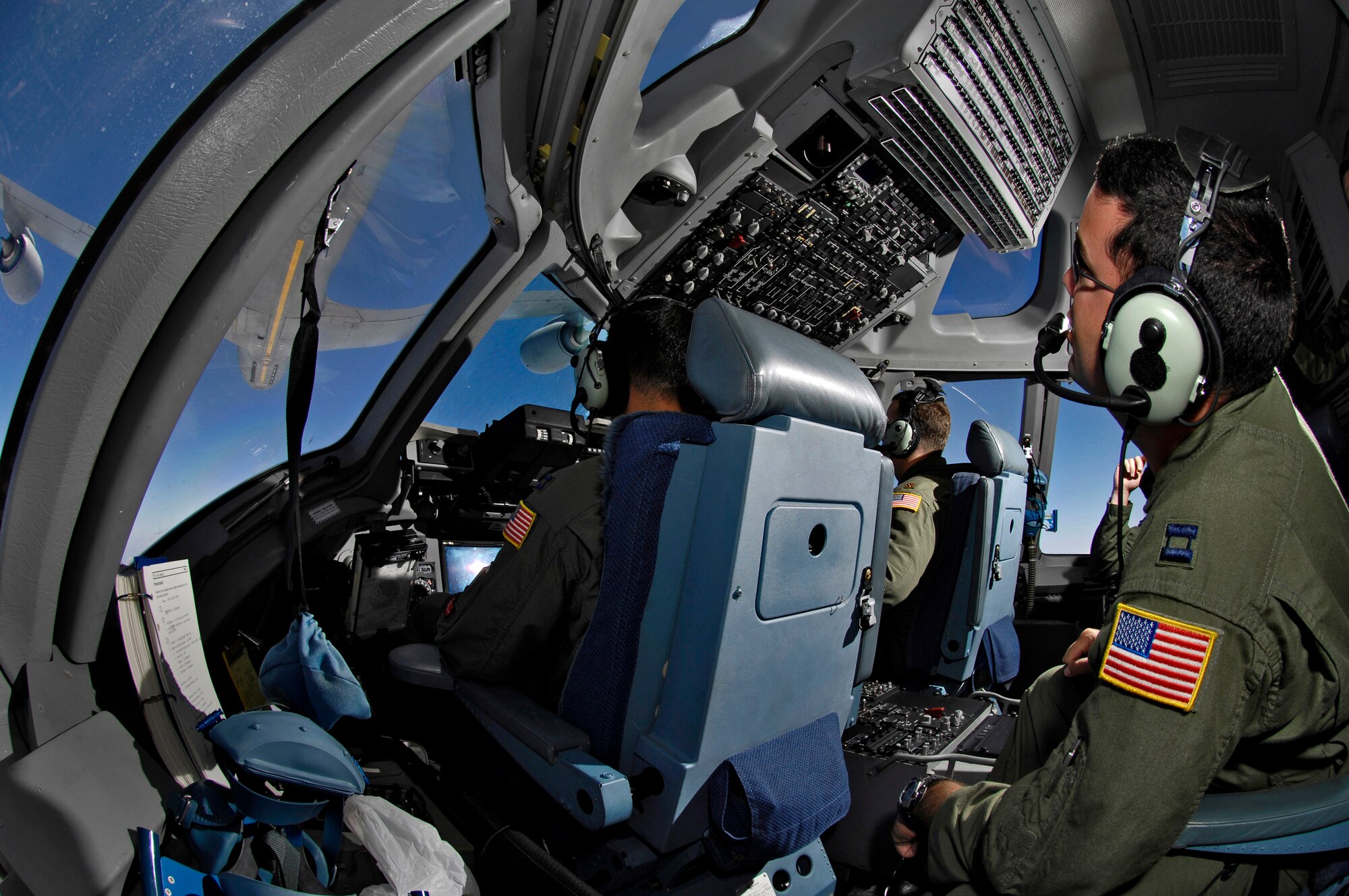 C-17 Globemaster III aircrew members practice aerial refueling as their aircraft receives fuel from a KC-135 Stratotanker June 22 during a refueling training mission over the Pacific Ocean. The C-17 from the 535th Airlift Squadron at Hickam Air Force Base, Hawaii, and the KC-135 from the 909th Air Refueling Squadron at Kadena Air Base, Japan, are practicing for the upcoming 2007 Air Mobility Command Rodeo. (U.S. Air Force photo/Tech. Sgt. Shane A. Cuomo)