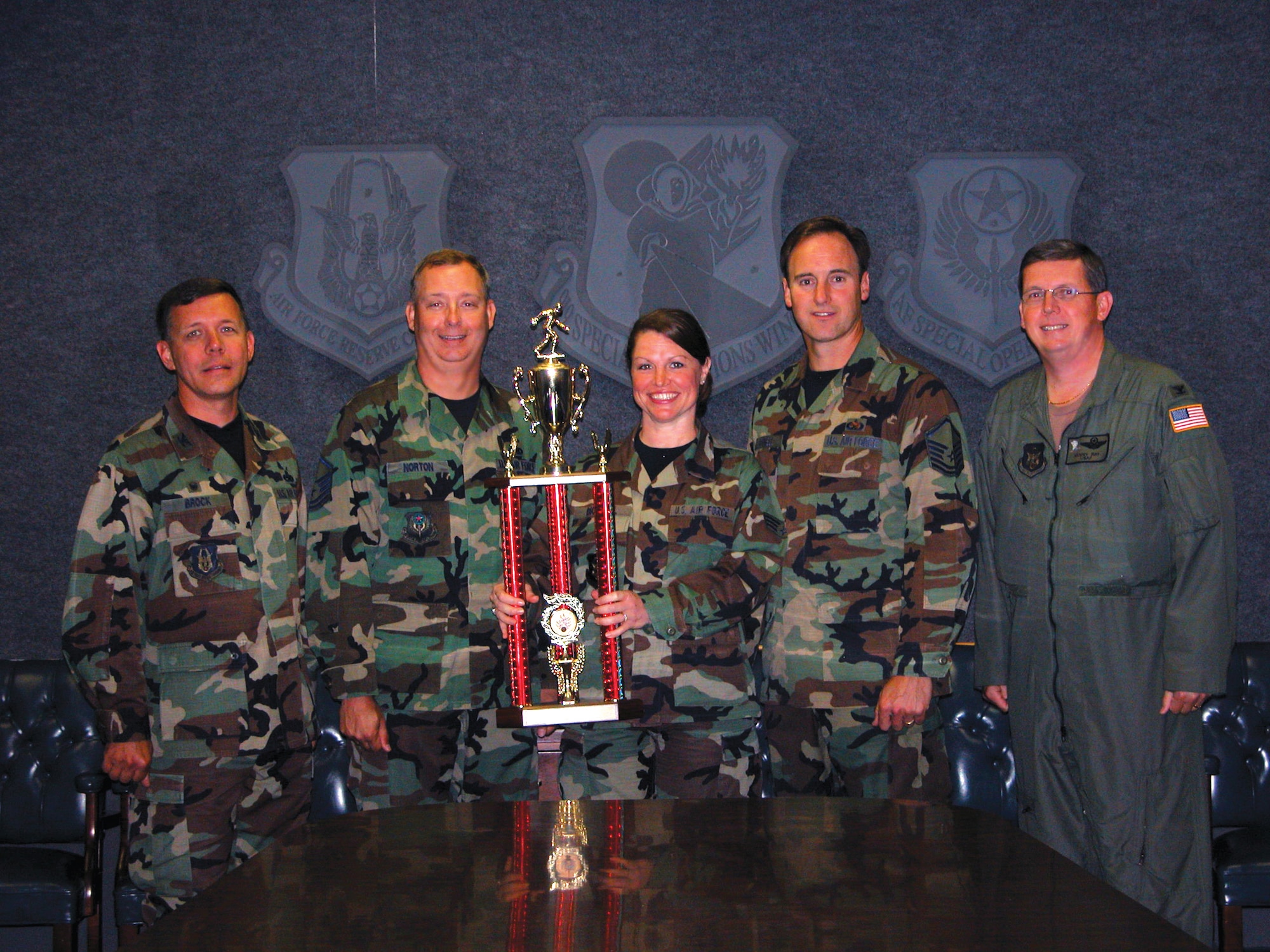 (Left to right) Col. James Brock, 919th Maintenance Group commander, Master Sgt. Jeffrey Norton, 919th Maintenance Squadron, Senior Airman Christina Bicknell,  919th Medical Squadron, Master Sgt. Steven Bicknell, 919th MXS, and Col. Kenneth Ray, wing vice commander, celebrate the 919th MXS Bowling Team?s win of the Eglin Air Force Base Bowling Championship. The two maintainers, dental assistant, and four team members beat the 96th Services Squadron May 29. (U.S. Air Force Photo\Jasmine DeNamur)