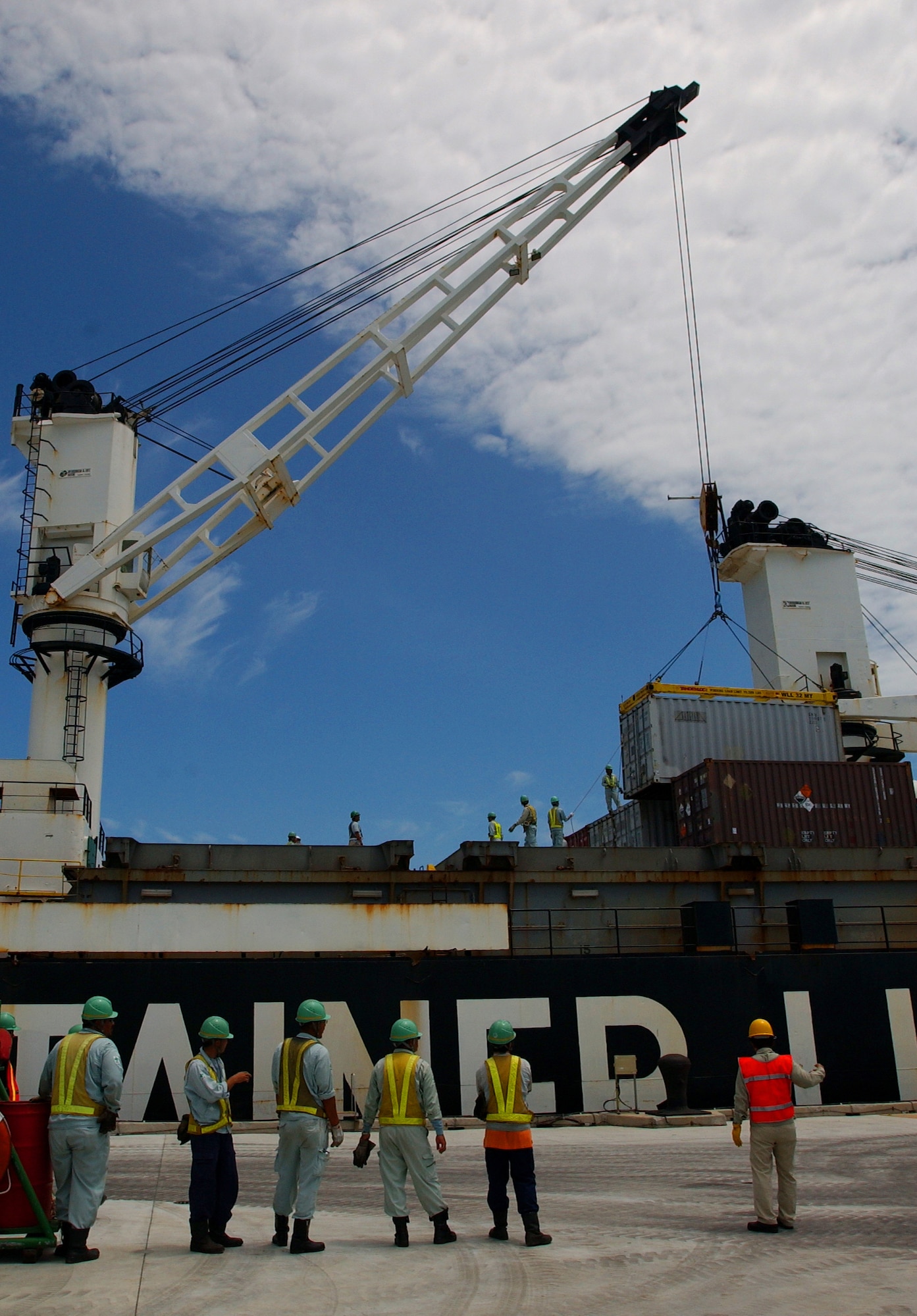 Containers of new munitions are unloaded from the Motor Vessel Global Patriot ship during the Turbo Containerized Ammunition Distribution System exercise June 22. The munitions were for all services in Okinawa.  The following day many containers filled with older munitions were onloaded to be shipped back to military installations in the U.S. for storage. U.S. Air Force photo/Staff Sgt. Reynaldo Ramon