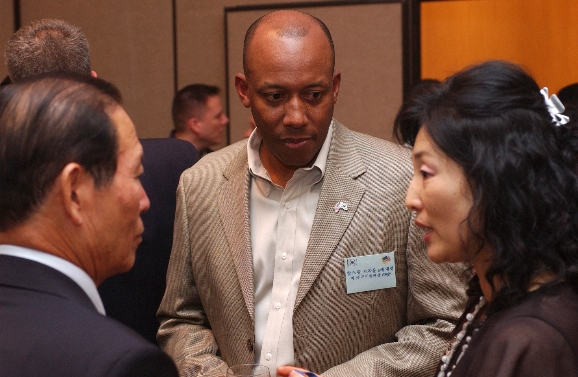 KUNSAN AIR BASE, Republic of Korea -- Col. CQ "Wolf" Brown, 8th Fighter Wing commander, talks with Gunsan City Mayor, Moon, Dong Shin, and Rosemary Song, 8th FW Public Affairs Office Community Relations Chief at the officer's club June 22. Colonel Brown hosted a dinner for eight Gunsan City civic leaders, including Mayor Moon.  The dinner provided a chance for Kunsan Air Base to build relationships with host-nation civic leaders and partners from Gunsan City. (U.S. Air Force photo/Senior Airman Steven Doty) 
                                                            
                             