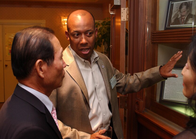 KUNSAN AIR BASE, Republic of Korea -- Col. CQ "Wolf" Brown, 8th Fighter Wing commander, talks with Gunsan City Mayor, Moon, Dong Shin, at the officer's club June 22. Colonel Brown hosted a dinner for eight Gunsan City civic leaders, including Mayor Moon. The dinner provided a chance for Kunsan Air Base to build relationships with host-nation civic leaders and partners from Gunsan City. (U.S. Air Force photo/Senior Airman Steven Doty) 
                             