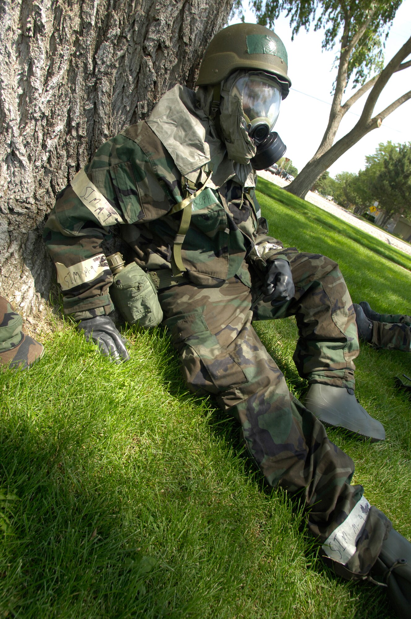 Airman Joseph Frick, 366th Component Maintenance Squadron, takes cover by the base theater after a missile attack near Base X, 27 June. The 366th Fighter Wing is currently conducting a Phase II exercise in which the whole base participates, so Airmen will be prepared for war. (U.S. Air Force photo/Airman 1st Class Ryan Crane)