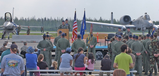 EIELSON AIR FORCE BASE, Alaska--EIELSON AIR FORCE BASE, Alaska-- More than 100 community members and Airmen attended a flag-folding ceremony for the 355th Fighter Squadron and the 18th FS June 23 during the 2007 Soaring into Solstice Open House. (U.S. Air Force photo by Senior Airman Justin Weaver) 