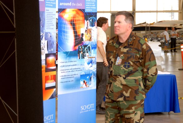 Col. Bryan Gallagher, 95th Air Base Wing commander, looks over an informational exhibit during NASA’s debut of SOFIA held at hanger 4802 Wednesday. SOFIA is an acronym which stands for Stratospheric Observatory For Infrared Astronomy. The aircraft is a highly-modified Boeing 747. (Photo by Airman Mike Young)