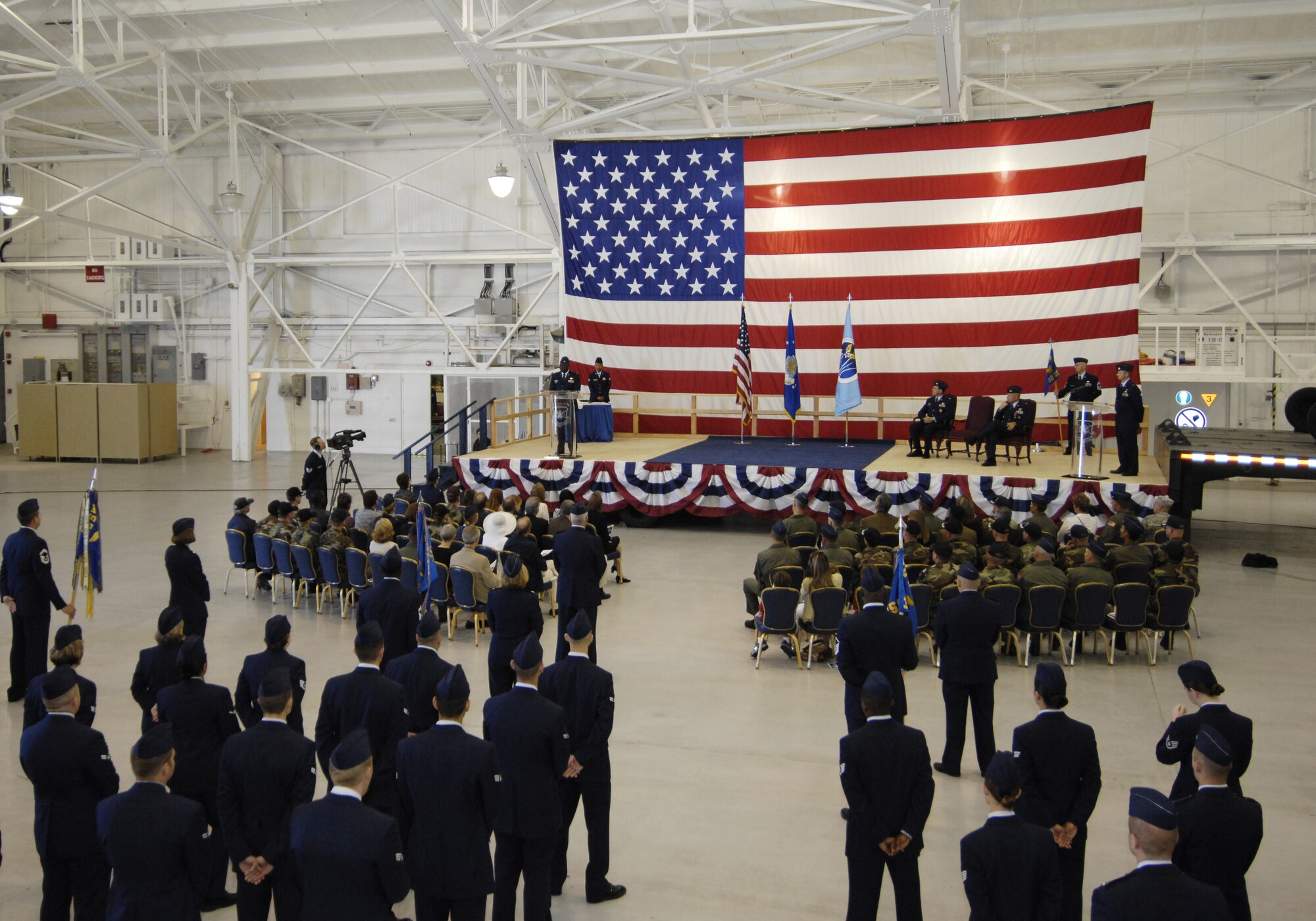 Col. Andre Lovett gives his first speech as the 30th Operations Group commander to more than 100 people during the change of command ceremony at the 76th Helicopter Squadron hangar June 22.  (U.S. Air Force photo/Airman 1st Class Johnathan Olds)