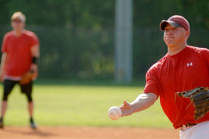Andy Clyde, 437 APS, throws a pitch to the OSS team hoping for a strike. (U.S. Air Force photo/Airman 1st Class Nicholas Pilch) 

