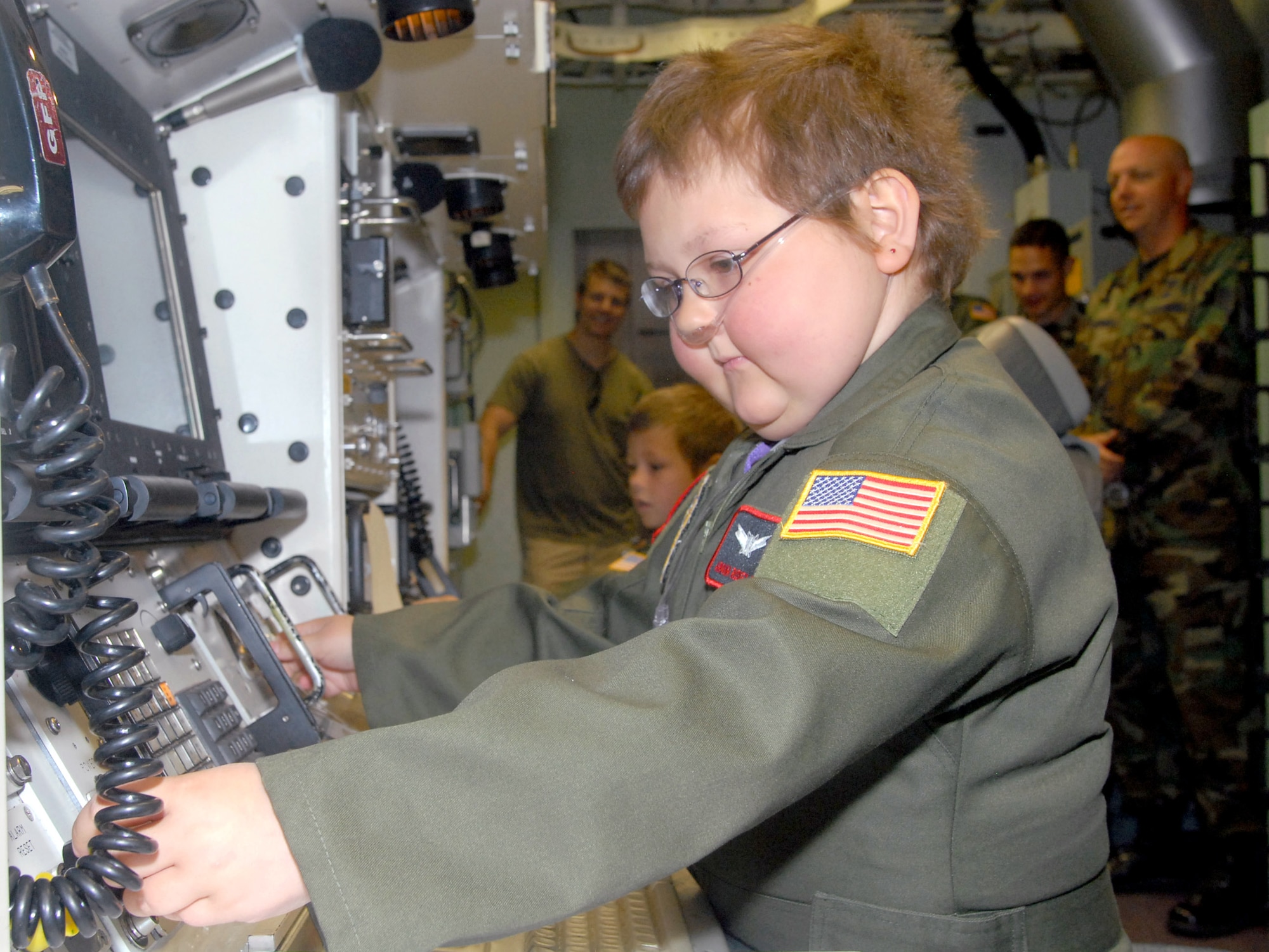 Ariana Ruskey-Moffett simulates a key-turn sequence that would launch intercontinental ballistic missiles in the missile procedures trainer June 11 at F.E. Warren Air Force Base, Wyo. Ariana, a cancer survivor, participated in the base's first Missileer for a Day Program that allows special children to live the life of a missileer for a day (U.S. Air Force photo/Shelley Raffl)
