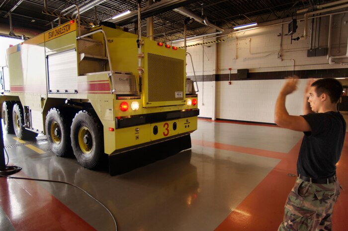Airman Thomas Lesley, 437th Civil Engineer Squadron firefighter, backs up a P-23 Airport Rescue Firefighting Apparatus at the base Fire Department June 20.  
