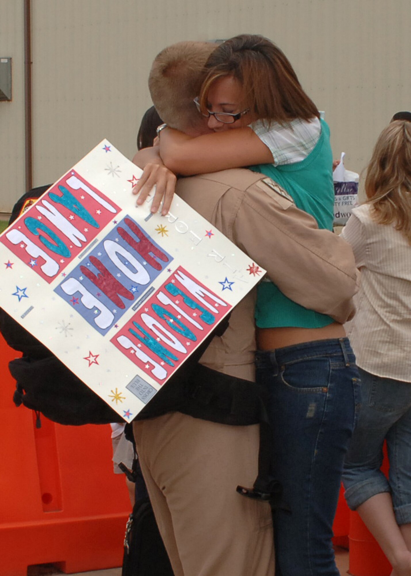 Ashley Dorenkamp welcomes back her husband, Capt. Lance Dorenkamp, a co pilot from the 40th Airlift Squadron, June 20. Captain Dorenkamp arrived back home after being deployed for more than four months supporting Operation Enduring Freedom. (U.S Air Force photo by Airman 1st Class Felicia Juenke)