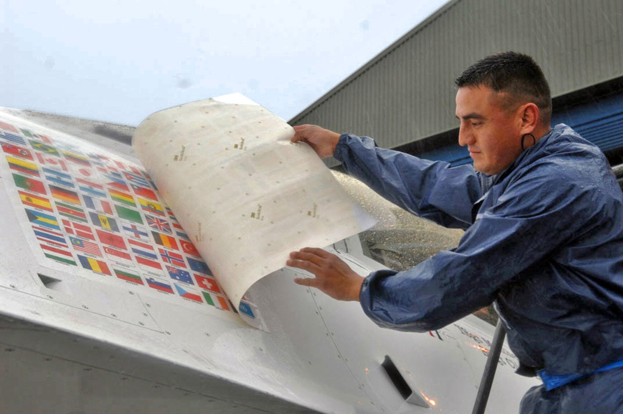 Prior to the Air Force Thunderbirds performing at the Salthill Air Show in Galway, Ireland, June 22, Staff Sgt. Adrian Quezada unveils the new Thunderbird flag panel, which now includes an Irish flag. This is the first time the Thunderbirds have performed over Irish soil. More than 100,000 people attended the air show, which was the team's first stop on their 2007 European Goodwill Tour. Sergeant Quezada is an assistant crew chief with the Thunderbirds.  (U.S. Air Force Photo/Staff Sgt. Kristi Machado) 