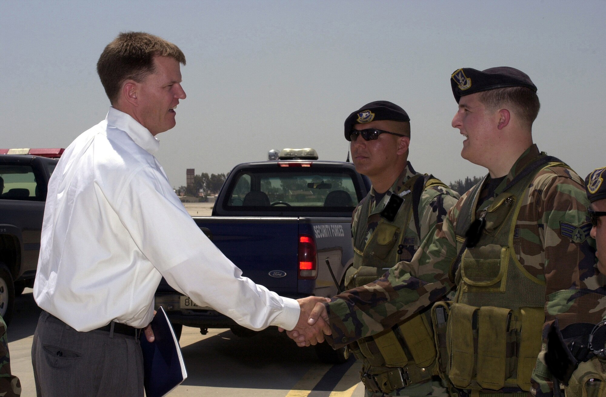 Dr. Ron Ritter, Special Assistant for the Air Force Smart Operations to the Secretary of the Air Force, shakes hands with the Airmen of the 39th Security Forces Squadron June 25. Dr. Ritter discussed Air Force Smart Operations 21 with the Airmen of Team Incirlik during his visit.  (U. S. Air Force photo by Staff Sgt. Jeff Nevison)                              