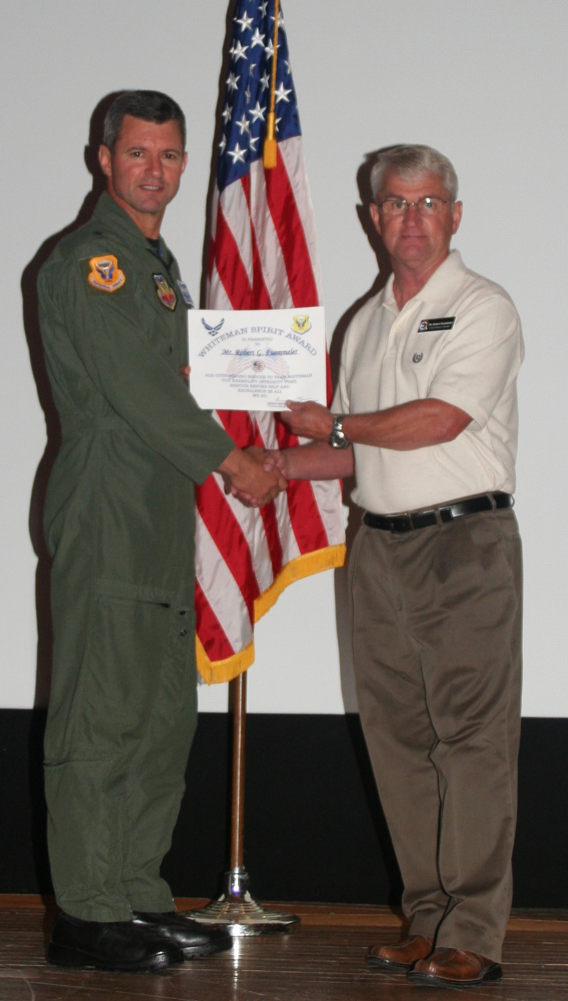 Robert Fuemmeler, 509th Mission Support Squadron, received the Whiteman Spirit Award from Brig. Gen. Greg Biscone, 509th Bomb Wing commander, June 22. (U.S. Air Force photo/Airman 1st Class Steven Linch)