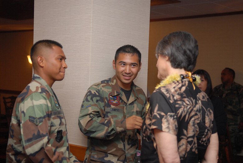 Airman 1st Class Melvin Batangan, 18th Logistics Readiness Squadron, with Airman Mark Campos, 18th Aircraft Maintenance Squadron, talk to Hawaii Governor Linda Lingle during her visit to Kadena Air Base, Japan, June 22. The governor spent 12 days in Jakarta, Tokyo and Okinawa, strengthening Hawaii's Asia-Pacific relations.
U.S. Air Force photo/Senior Airman Jeremy McGuffin