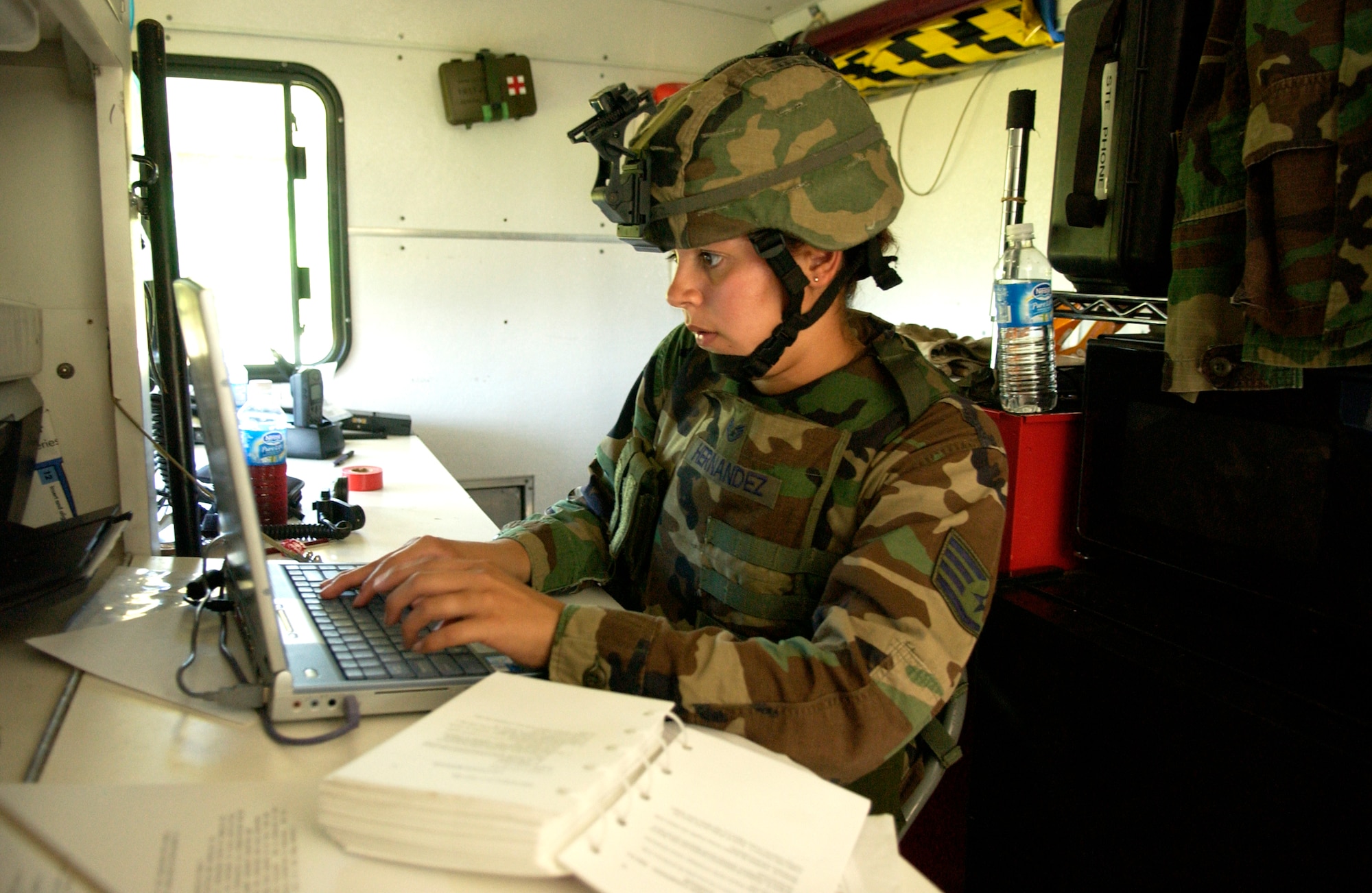 ANDERSEN AFB, GUAM--Staff Sergeant Blanca Hernandez, 36th Contingency Response Group, works communications during Field Exercise Training held by the 36th Contingency Response Group, June 21, 2007.   The week long exercise is being held to meet 36 CRG End of Quarter Performance Objectives that include mission analysis and exercising the deployment process.(U.S. Air Force photo by Senior Airman Miranda Moorer)(RELEASED)                                 