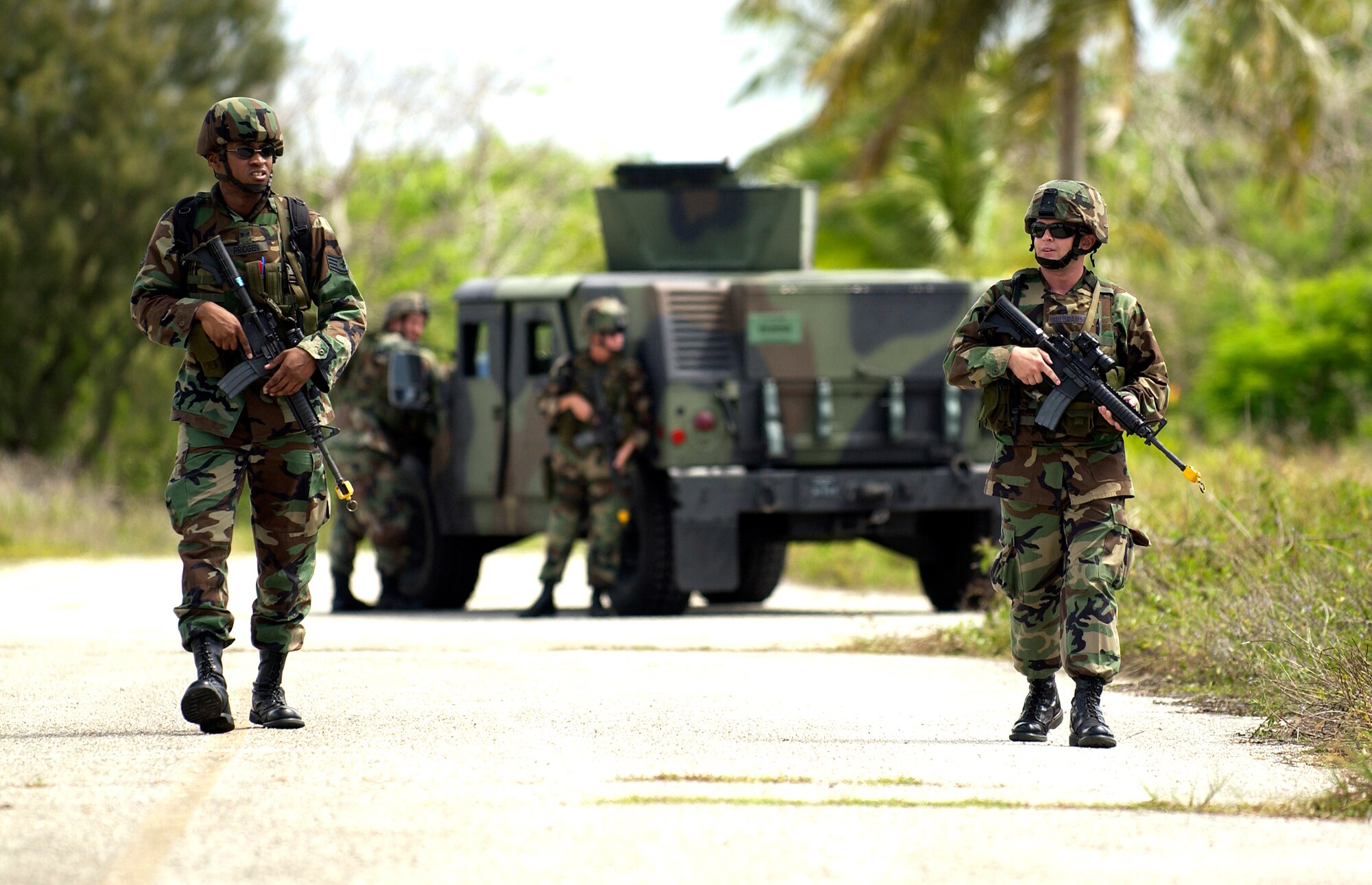 ANDERSEN AFB, GUAM--Staff Sergeant Juan Pridgen and First Lieutenant Tim Gulbranson, 36th Contingency Response Group, patrol the area during Field Exercise Training held by the 36th Contingency Response Group, June 21, 2007.   The week long exercise is being held to meet 36 CRG End of Quarter Performance Objectives that include mission analysis and exercising the deployment process.(U.S. Air Force photo by Senior Airman Miranda Moorer)(RELEASED)                                 