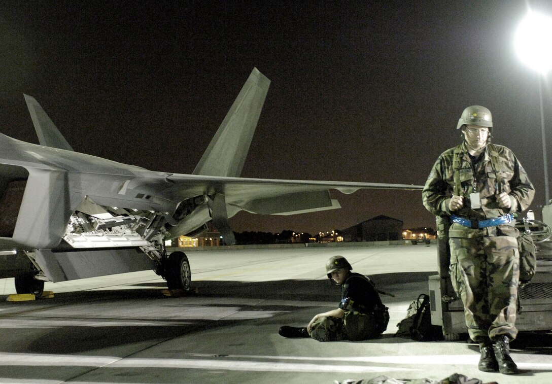 LANGLEY AIR FORCE BASE, Va. -- Members from the 94th Aircraft Maintenance Unit stand guard during a Phase II exercise here June 27. The 1st Fighter Wing’s Phase II Operational Readiness Exercise is an evaluation of employment, mission support and the ability to survive and operate. (U.S. Air Force photo/Staff Sgt. Austin Knox)  