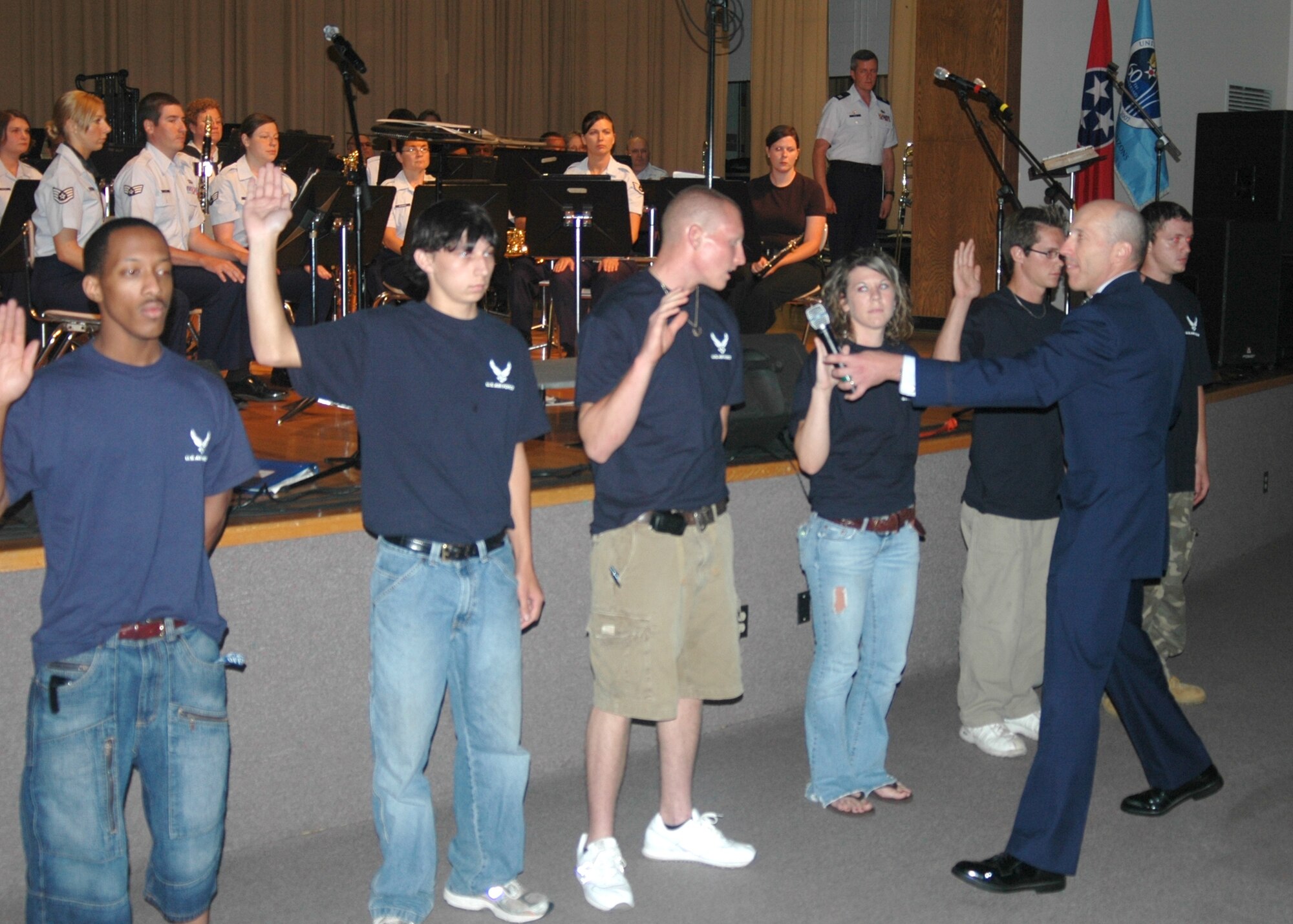 Arnold Engineering Development Center Commander Col. Art Huber swore in six new recruits June 27 during the Air Force 60th anniversary celebration in McMinnville, Tenn. From left, the recruits are Jonathan Sanders, Shelbyville, Tenn.; Gerald Neal, Manchester, Tenn.; Josh Clark, Smyrna, Tenn., Holly Hughes, Smithville, Tenn.; Timothy Moynihan, Shelbyville; and Josh Nokes, Smithville.