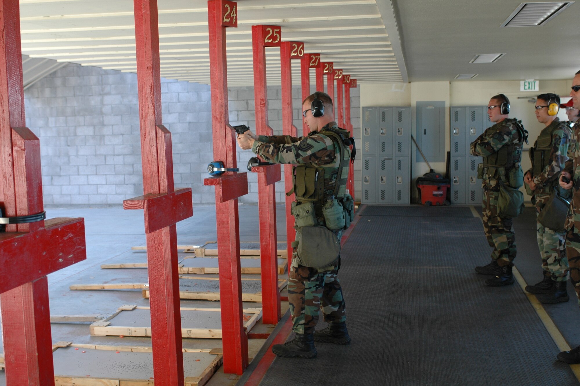 Tech. Sgt. William Rendall, 60th Security Forces Squadron, shoots an M-9 handgun during training June 22. The team practices daily to prepare for the upcoming Rodeo Challenge at McChord Air Force Base, Wash. (U.S. Air Force photo by Airman 1st Class Kristen Rohrer)