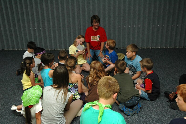 LuAnn Barnes, a volunteer leader for Vacation Bible School at the chapel, leads the Little Warriors in a group discussion.  (U.S. Air Force photo / Airman 1st Class Dillon White)