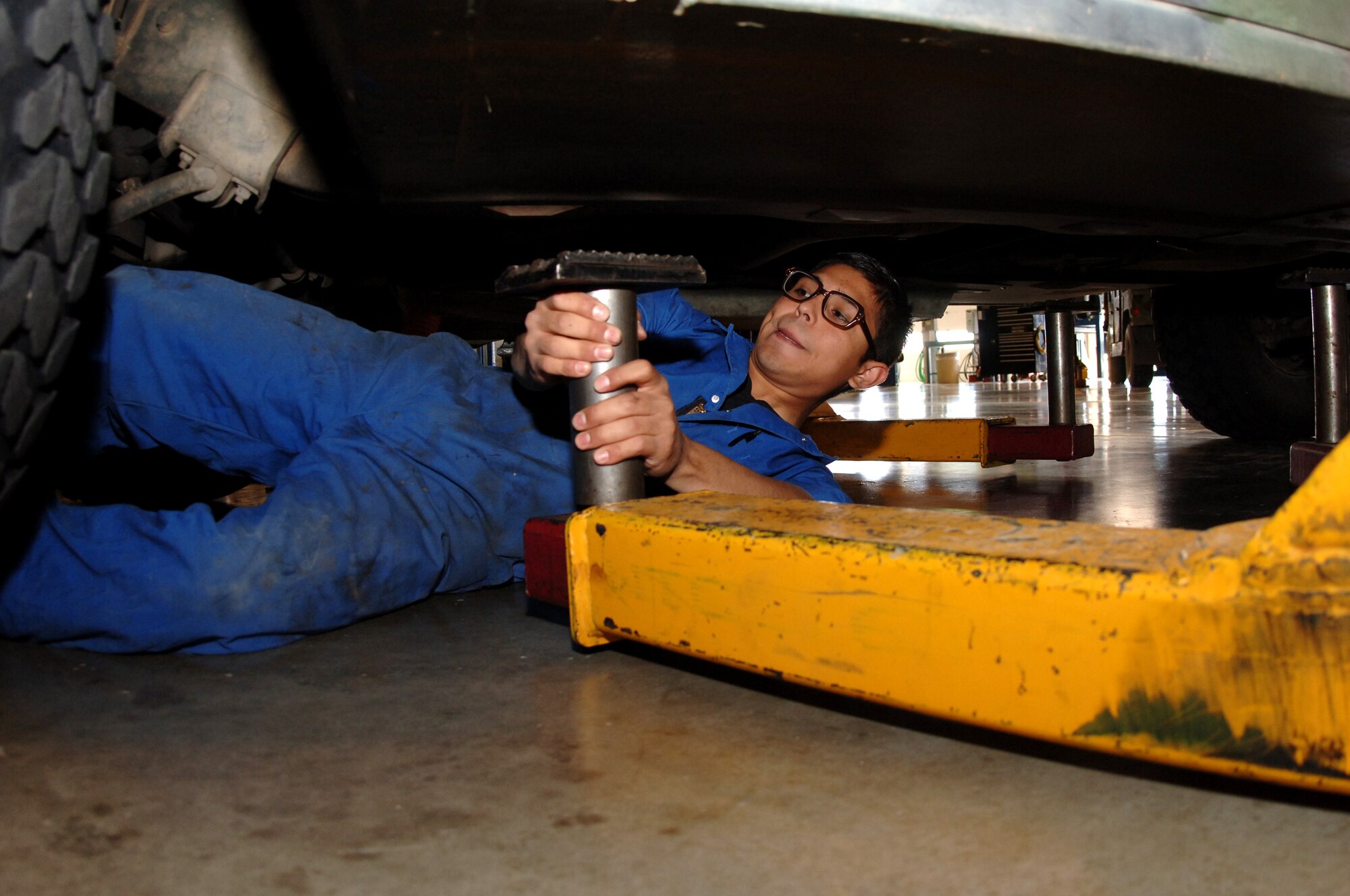 Senior Airman Sinohe De La Rosa, 341st Logistics Readiness Squadron vehicle maintenance journeyman, adjusts a vehicle hoist during a Nuclear Surety Inspection scenario June 18. (U.S. Air Force photo/Staff Sgt. Chenzira Mallory)