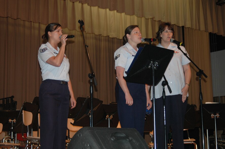 Air National Guard Band of the Smoky Mountains members Staff Sgt. Michelle McGill and Senior Airmen Elisa Wardeska and Laurie Reeves sing during the Air Force's 60th anniversary celebration in McMinnville, Tenn., June 27.