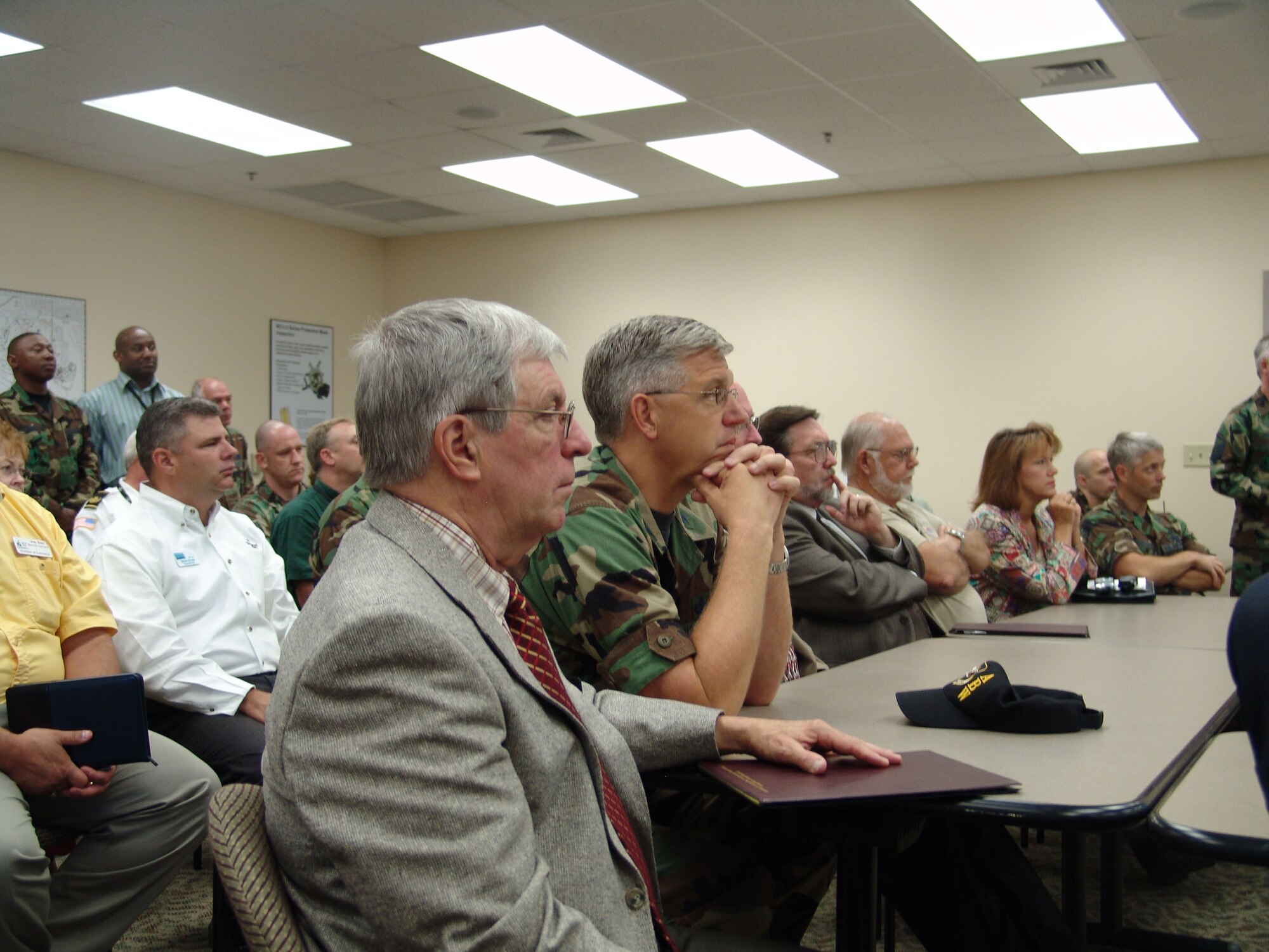 EGLIN AIR FORCE BASE, Fla. -- Col. Dean Clemons, 96th Air Base Wing commander, listens to a briefing on emergency operations today.  Local community leaders toured the emergency operations center during the base's annual hurricane exercise. (USAF Photo by Lois Walsh)